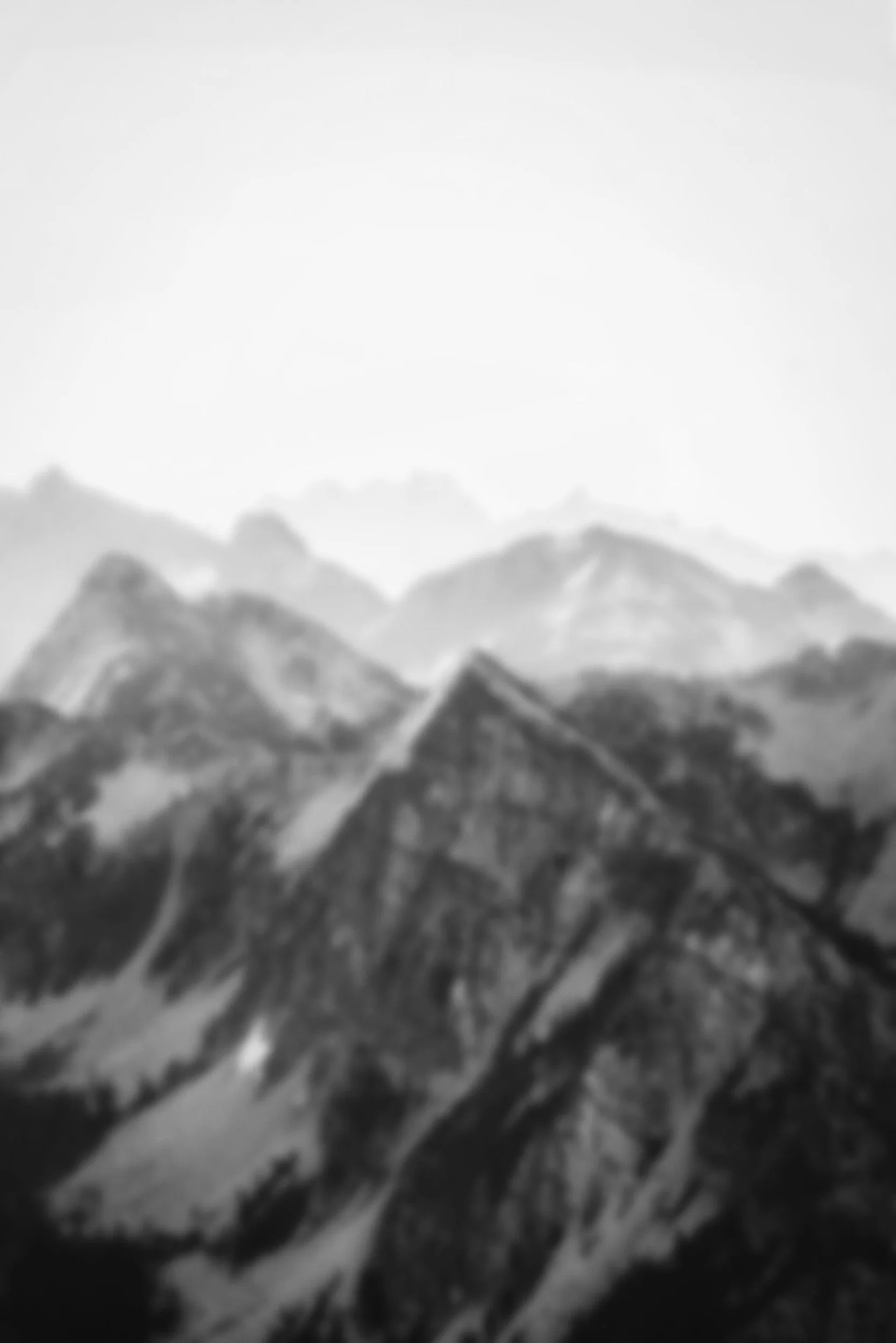 Blurry grayscale image of mountains