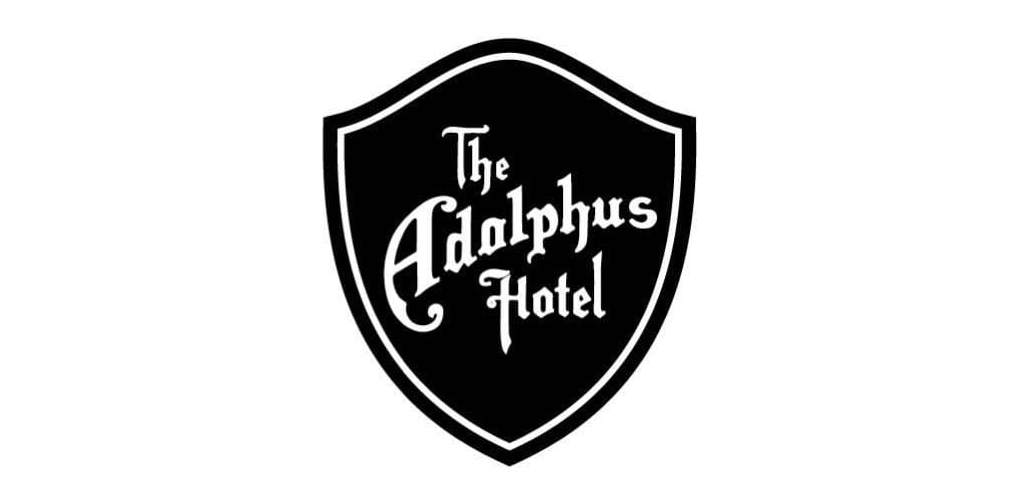 Black and white shield logo for The Adolphus Hotel with decorative lettering