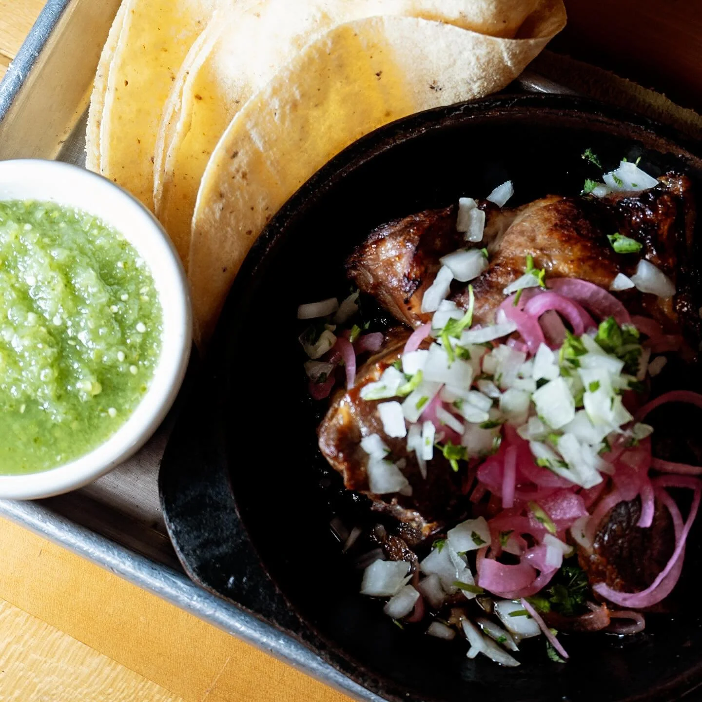 Sweet, salty pork goodness + perfectly bright and tangy tomatillo salsa all scooped up with La Finca corn tortillas, makes our carnitas plate a fan favorite. And don&rsquo;t  be afraid to pair it with a margarita for ultimate enjoyment😉#carnitas #la
