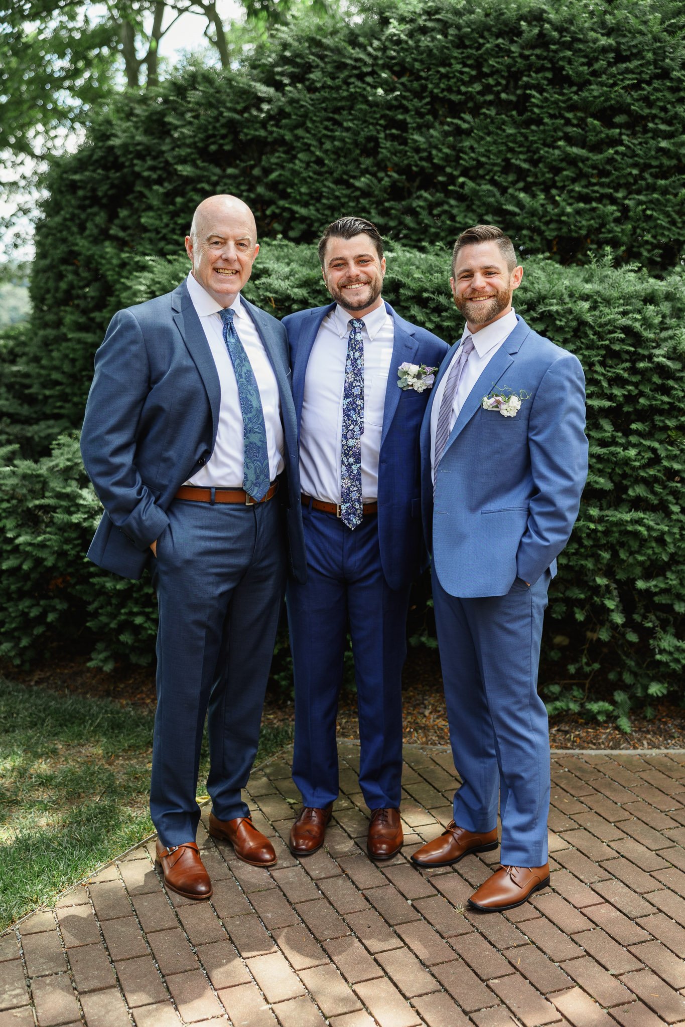 a group shot of the groom and two other members of the wedding party, taken at Drumore Estate