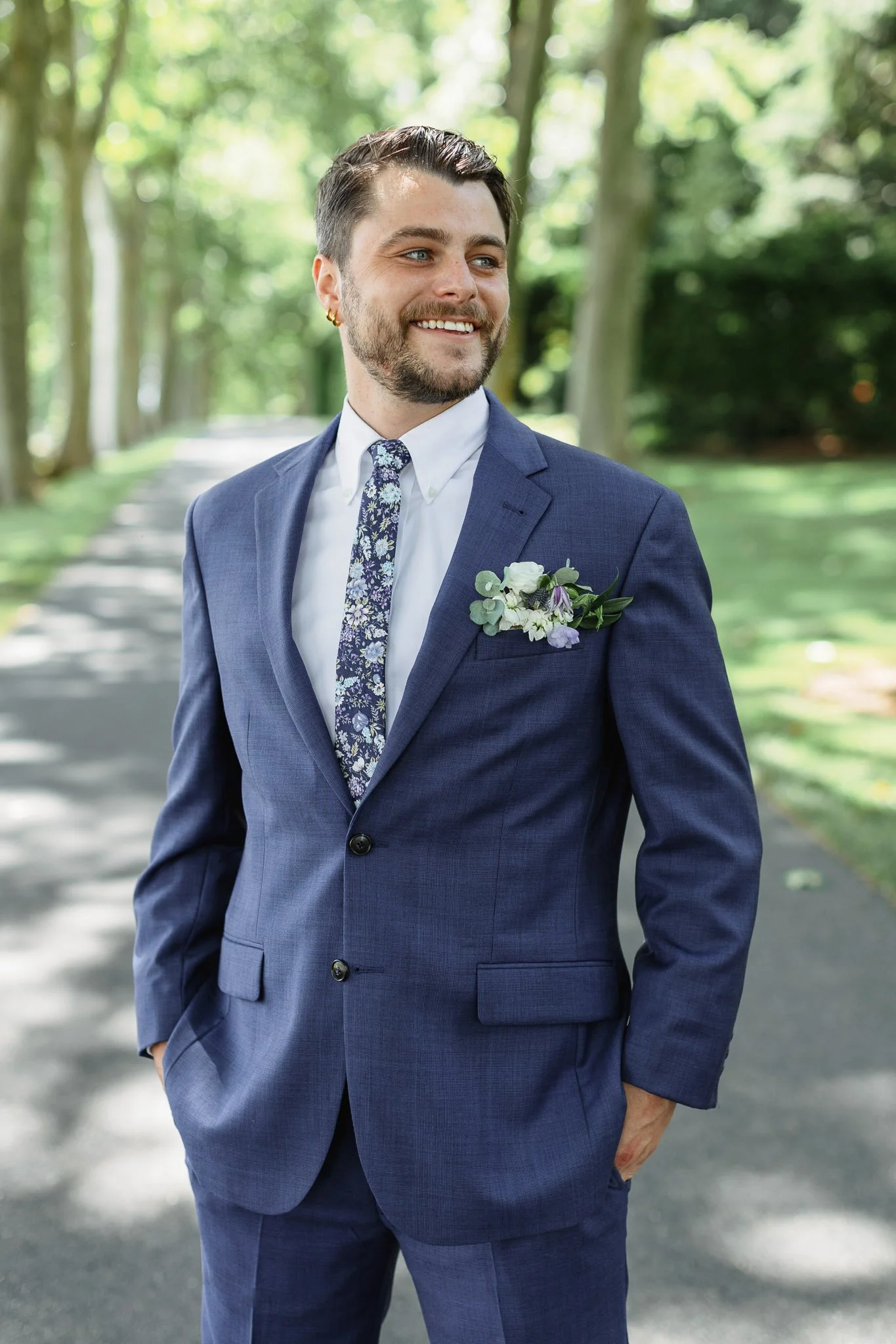 A solo shot of the groom enjoying the lush greenery of the Drumore Estate