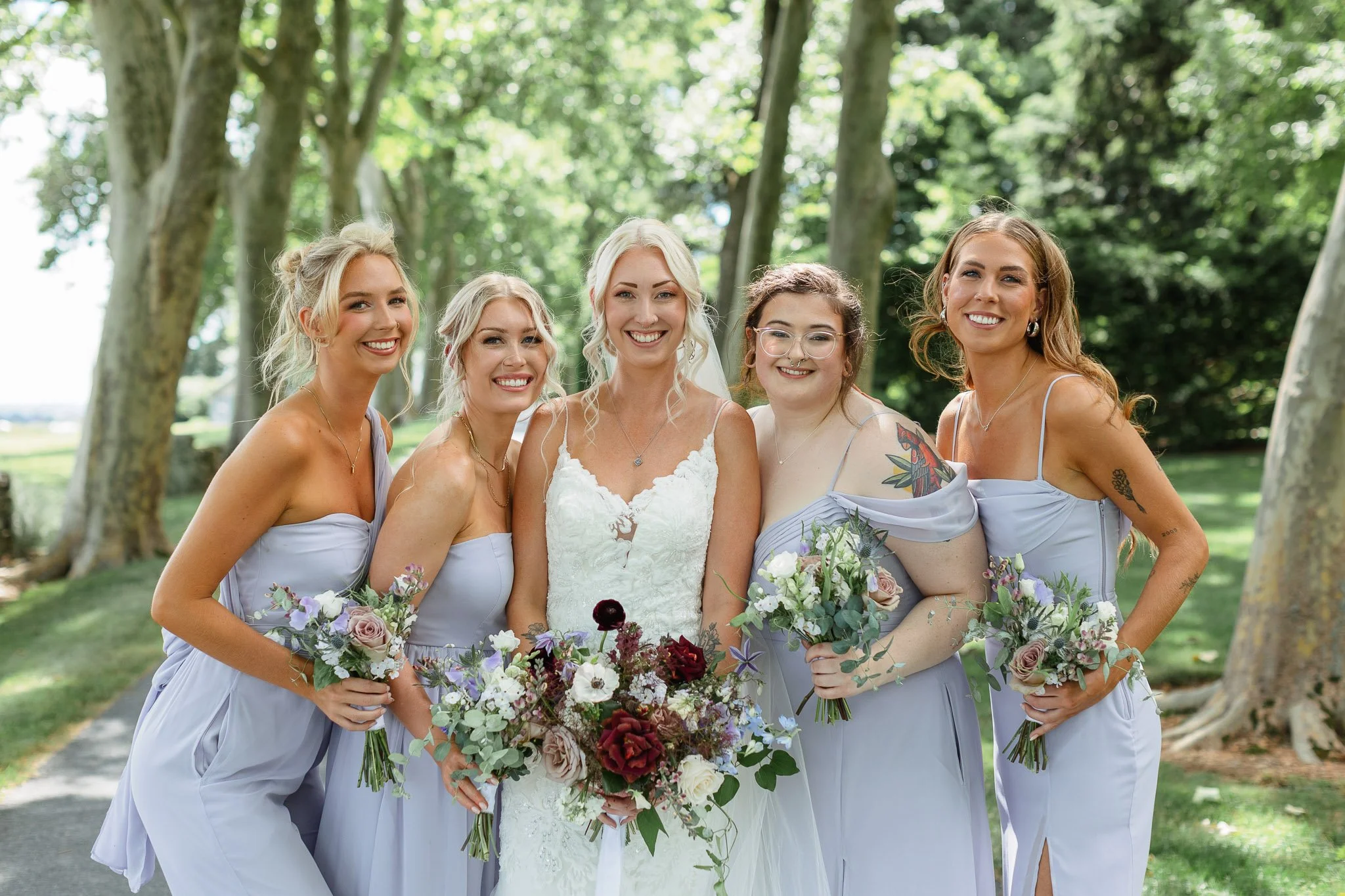Artistic wedding photo of the bridesmaids with their bride at Drumore Estate