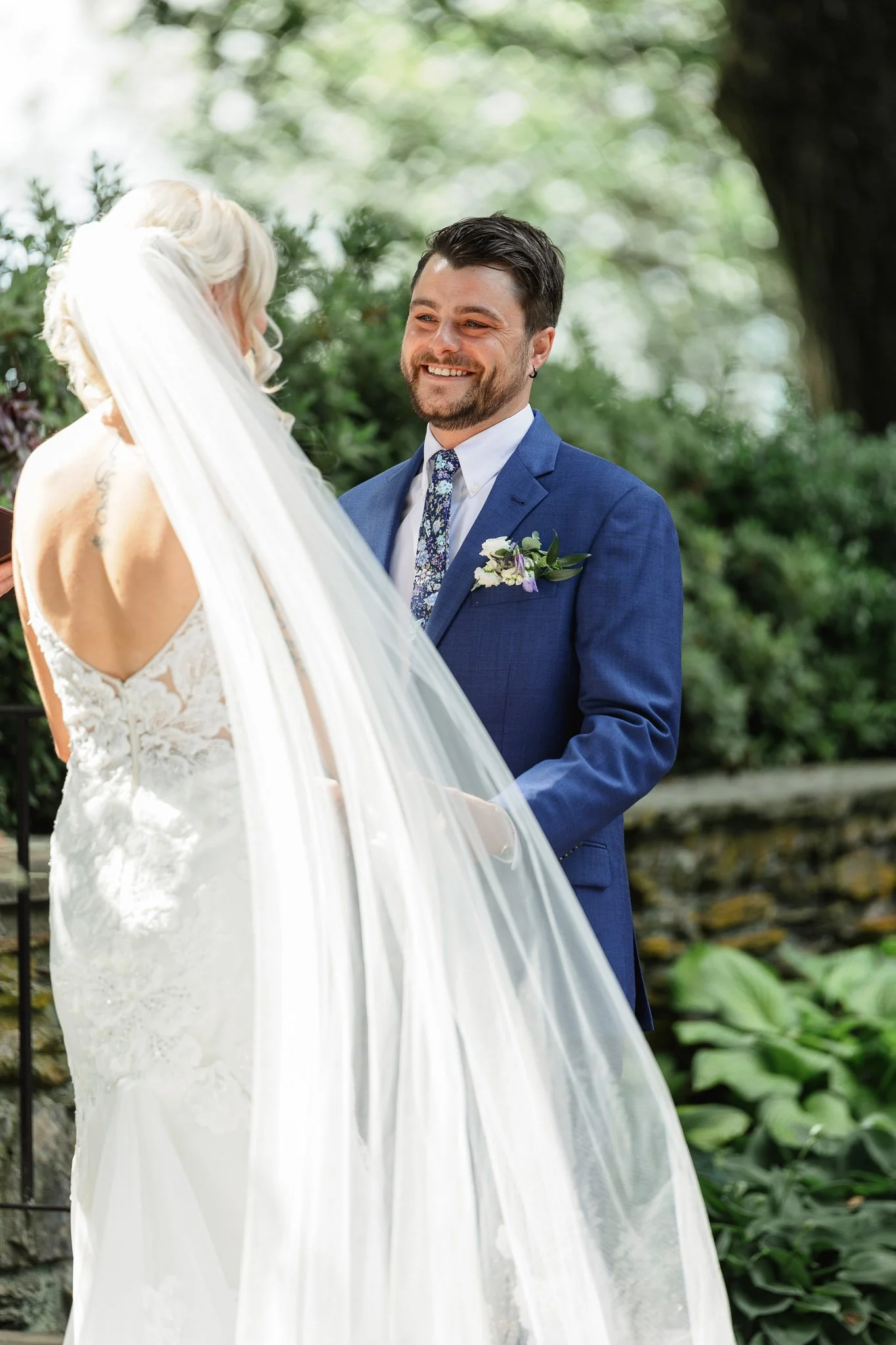 A stylistic wedding photography shot of the bride's veil waving in the wind at Drumore Esate