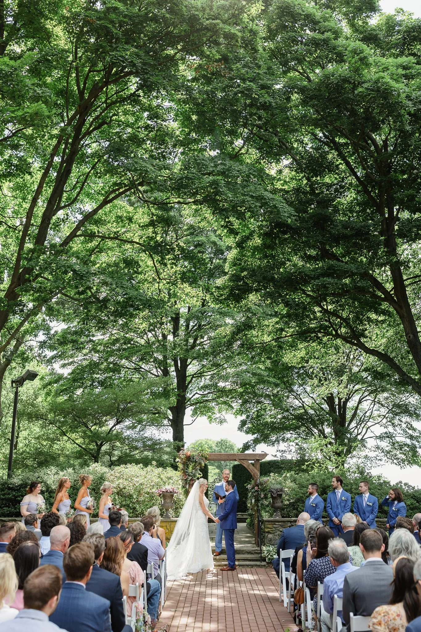 A wide angle wedding photo of a ceremony at Drumore Estate
