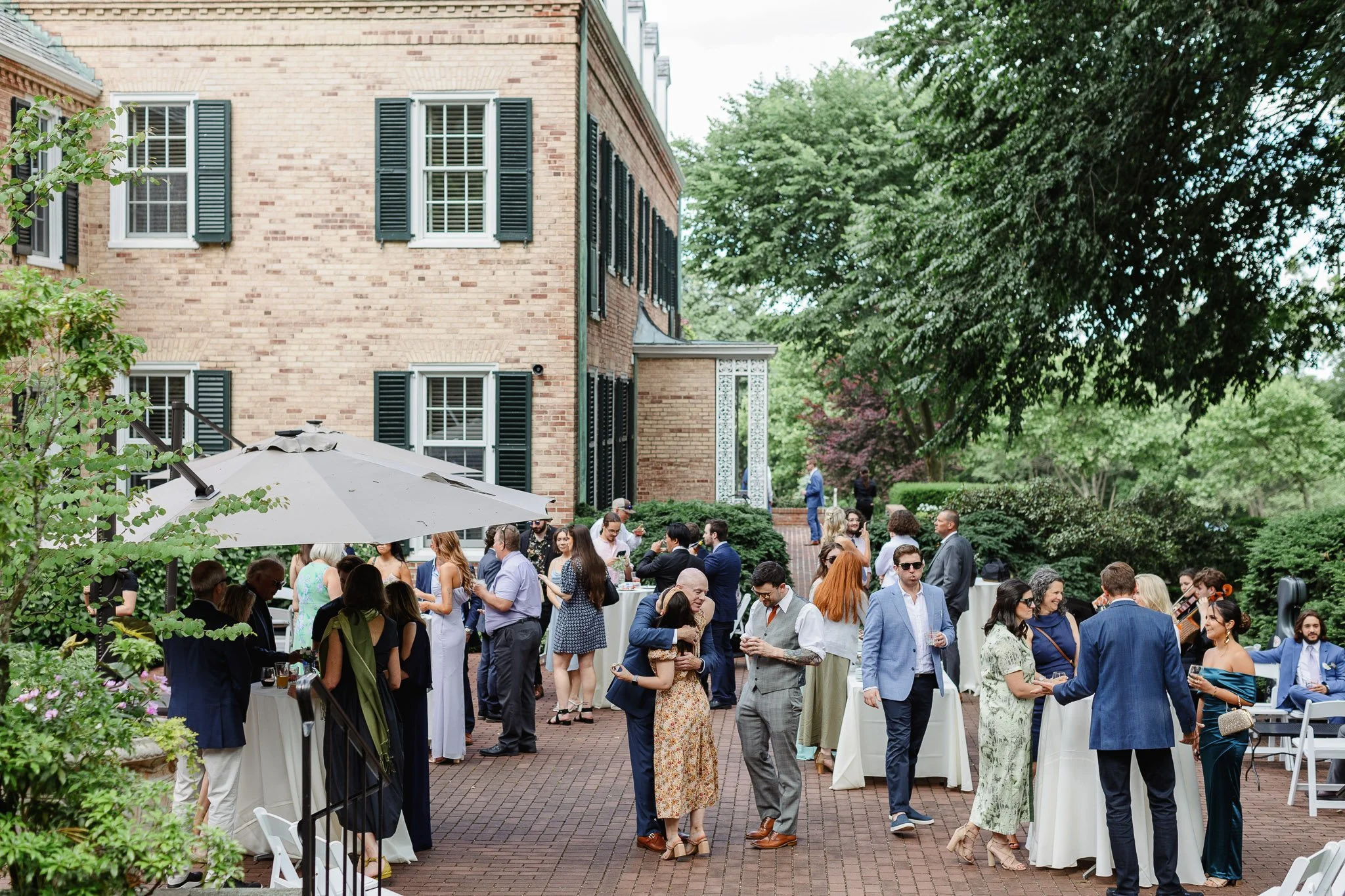 A wide angle shot of a wedding crowd at Drumore Estate, outside of The Mansion