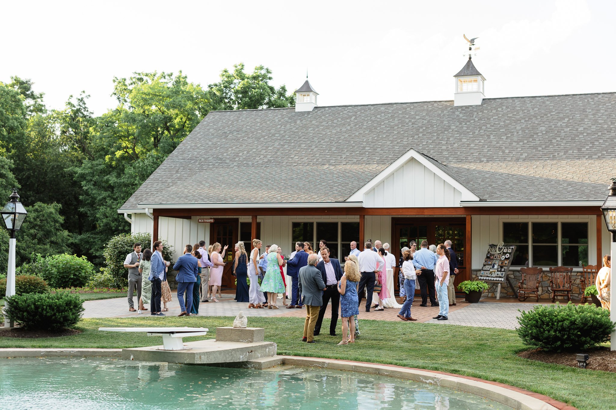 A wedding photographer captures guests milling around the Drumore Estate venue