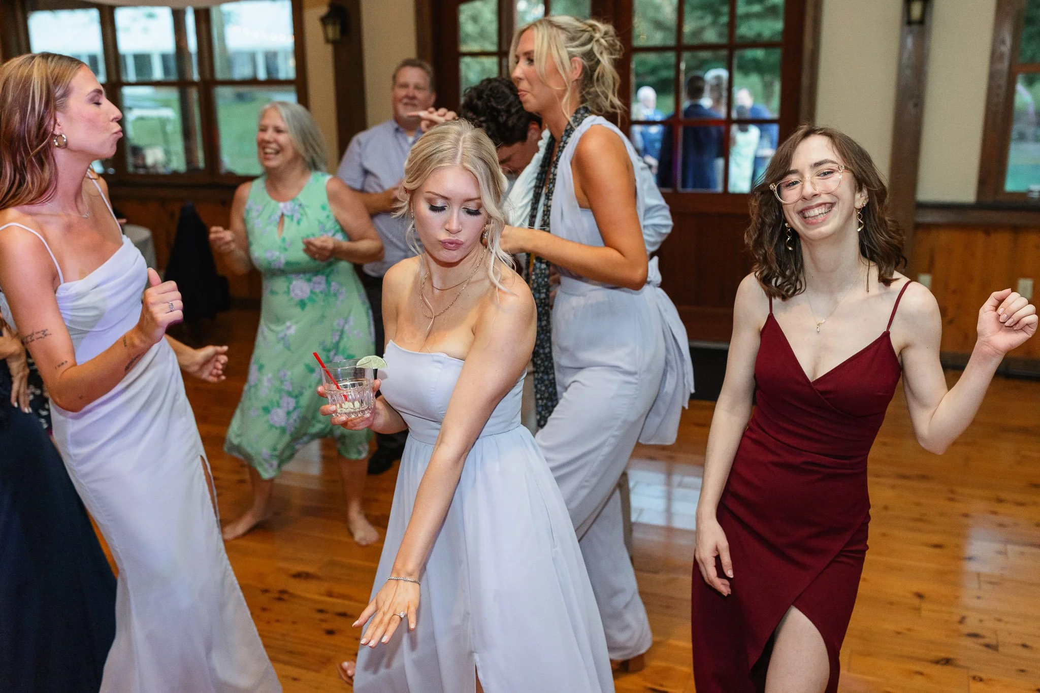 Guests of all ages laughing and dancing together during the wedding celebration at Drumore Estate.