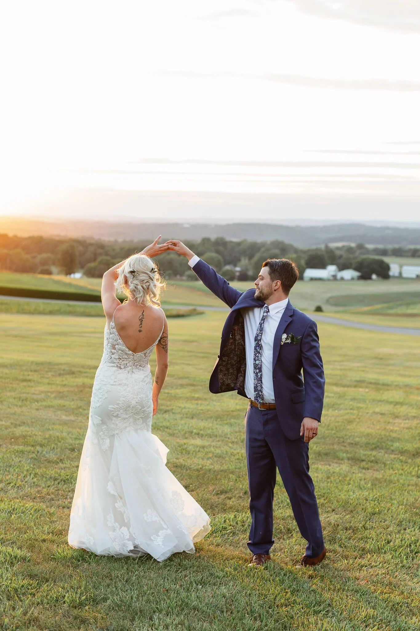 Warm sunset light peeks over the mountains, framing the couple for a private moment.