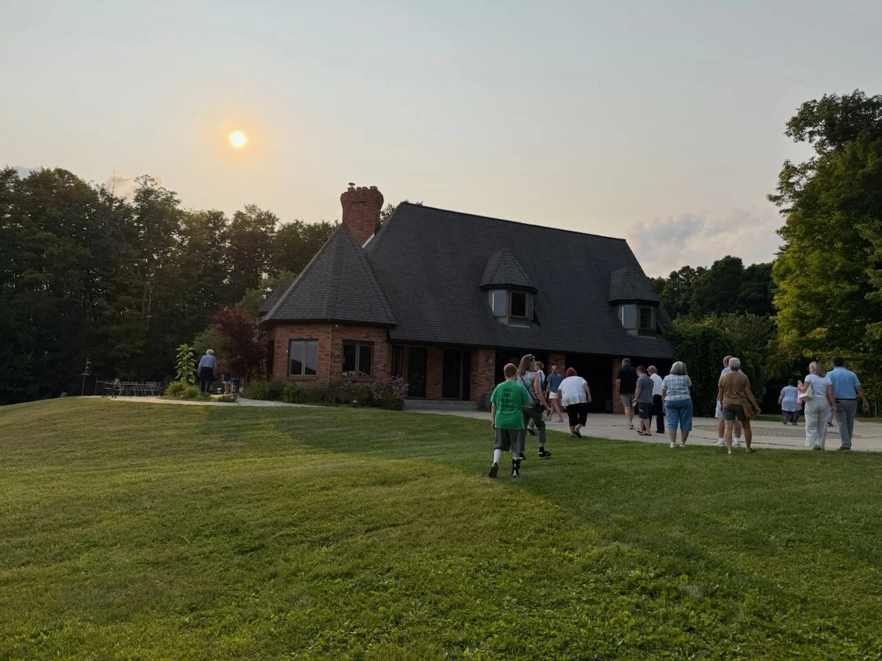 Supporters walking up to the Hope Ridge campus at sunset
