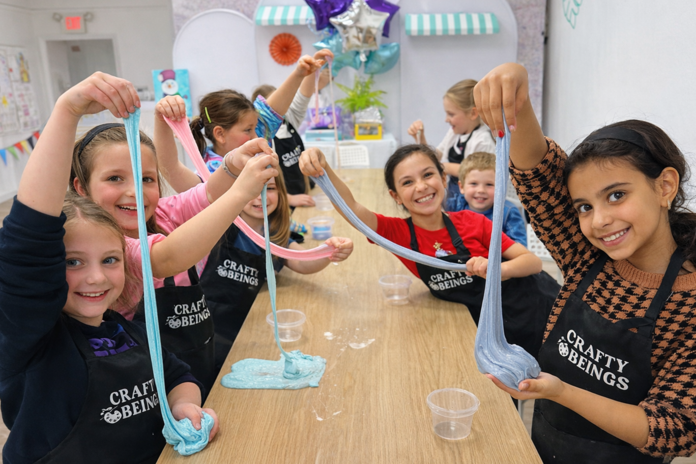 Kids making colorful slime during a slime birthday party at Crafty Beings DIY studio.