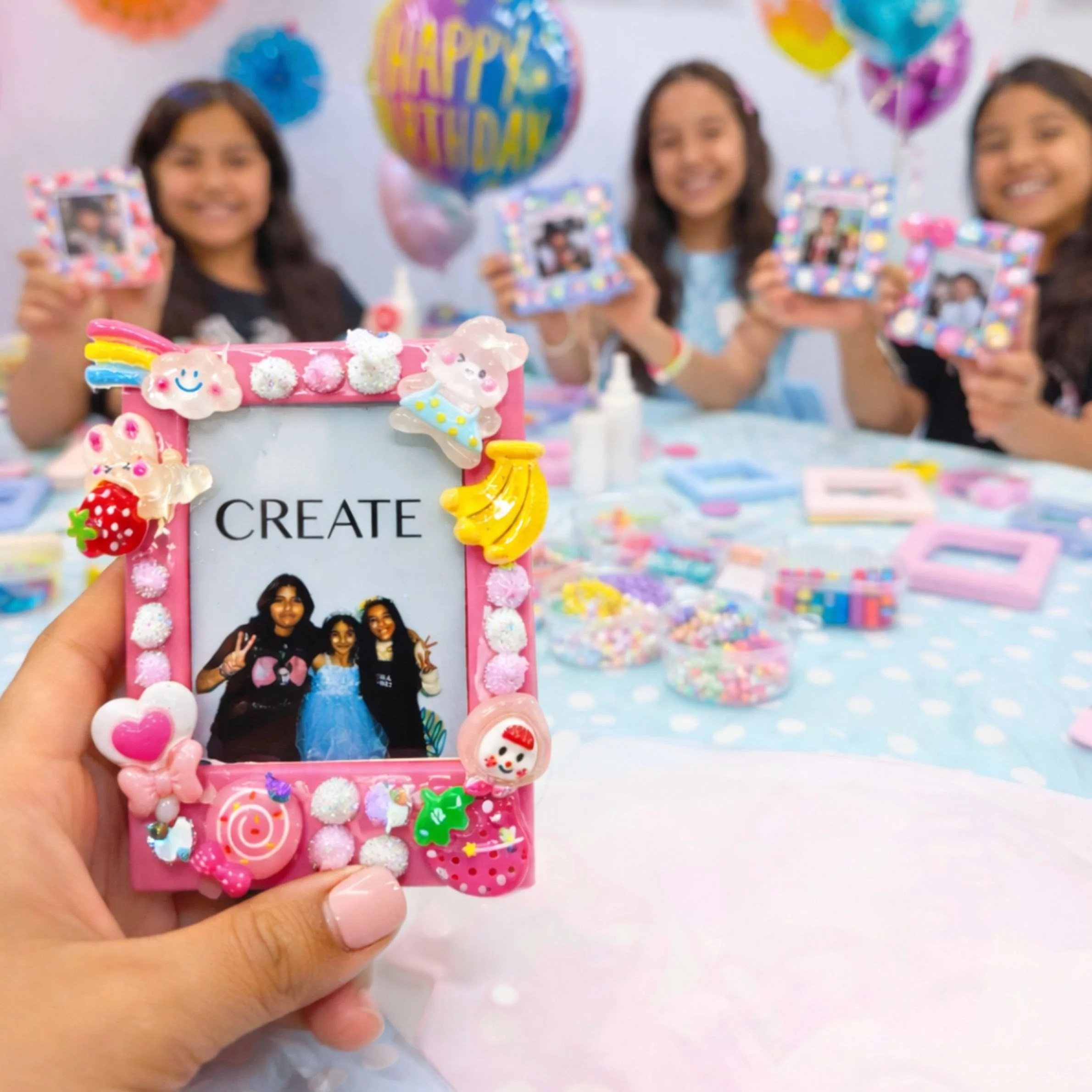 kids holding their photo frame creations