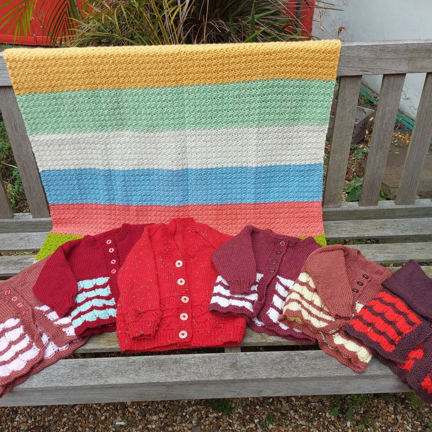 We received a big bundle of lovely things from Hands Together Group at Amersham Free Church.  You can never go wrong with a stripe on a blanket, and we really like the colour choice in this crocheted one. Colour and stitch details in these children's