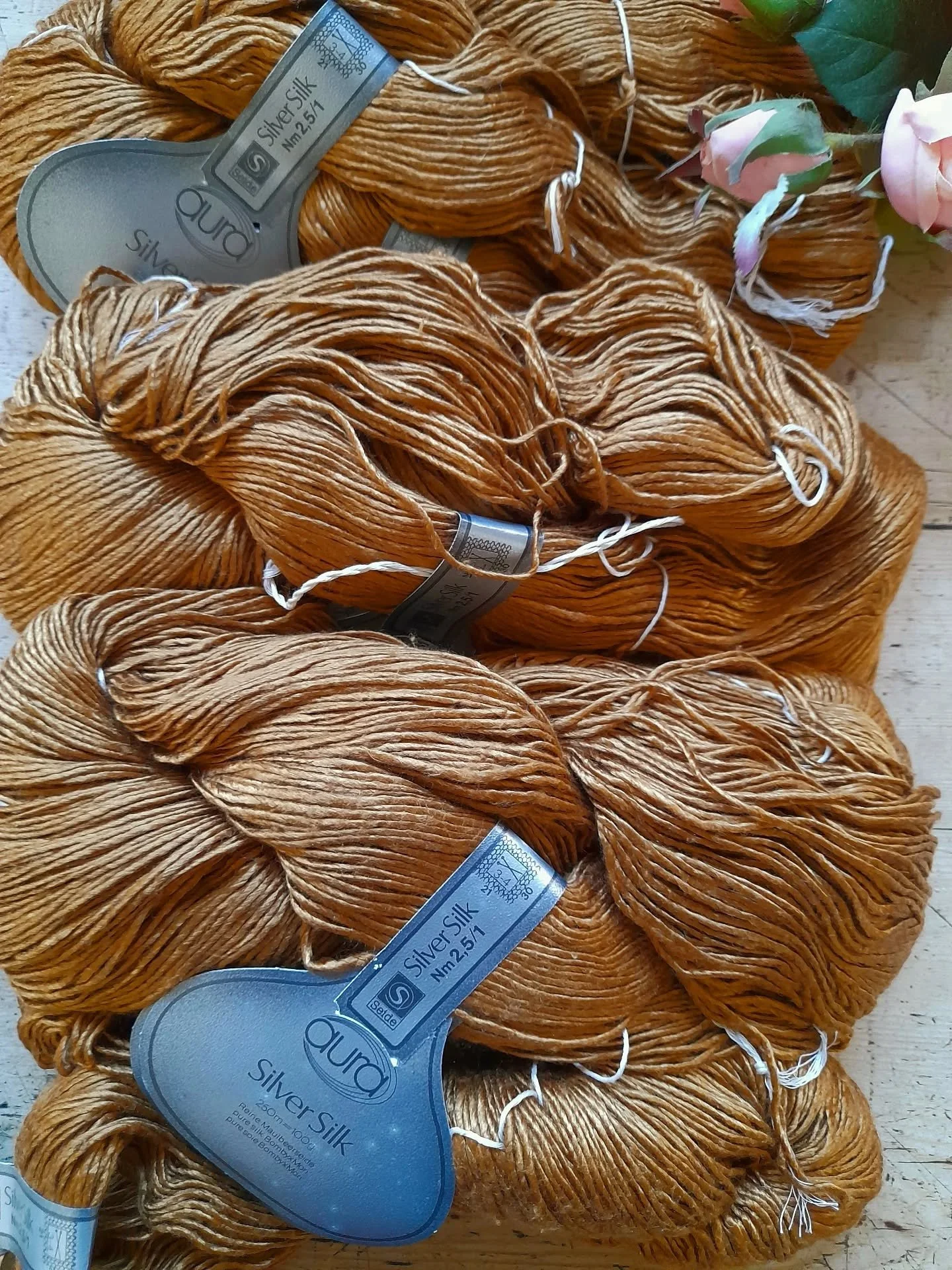Have a look at our online shop, where we have a range of yarn batches to suit all budgets. We keep it updated regularly, so do pop back!

This Aura Silver Silk is imported from Germany and is a  beautiful soft 100% silk yarn with a luxurious sheen.

