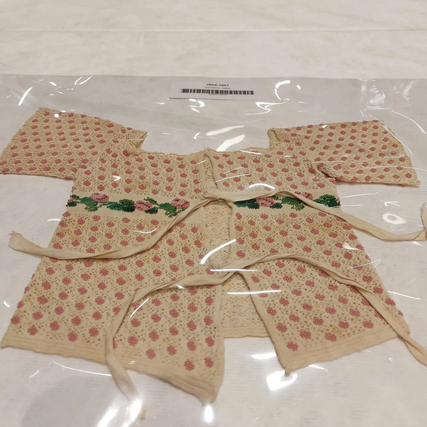 For our last item from my recent visit to V&amp;A Storehouse Study Room, this is a baby layette from early 19th Century. It is decorated with tiny beads.  The lighting in the Storehouse isn't helpful for photography, and the layette is stored in refl
