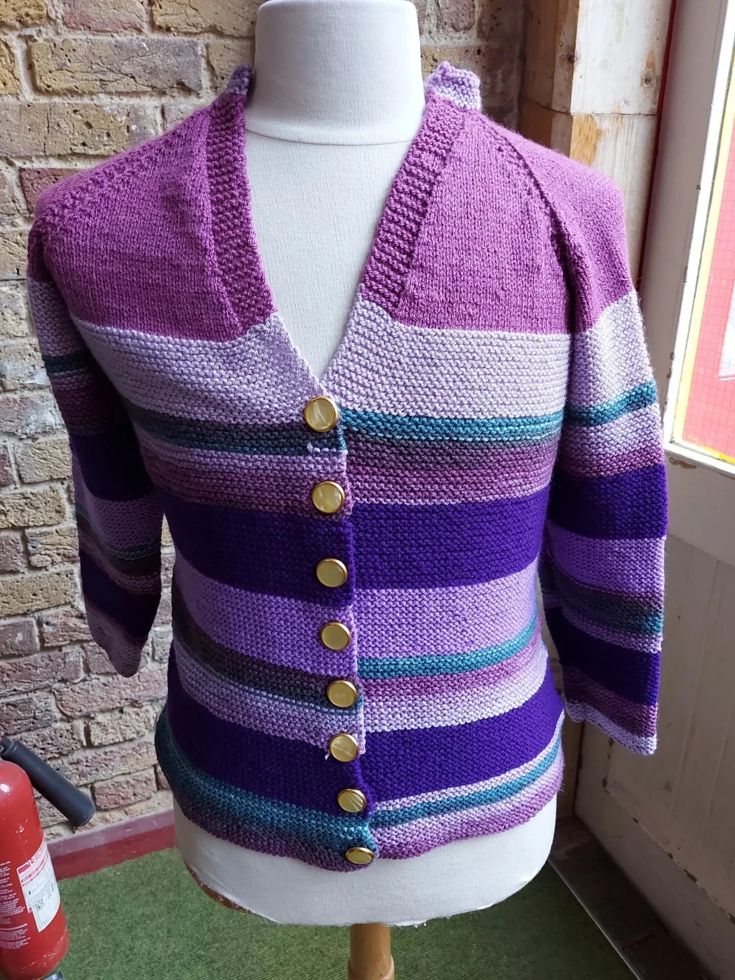 Willow Court Knit and Natter in Swansea has sent us a big batch of lovely yarny things.  We especially like this cardigan, which has given us inspiration to use a variety of colours and to celebrate stripy things.  The blanket is constructed as a ser