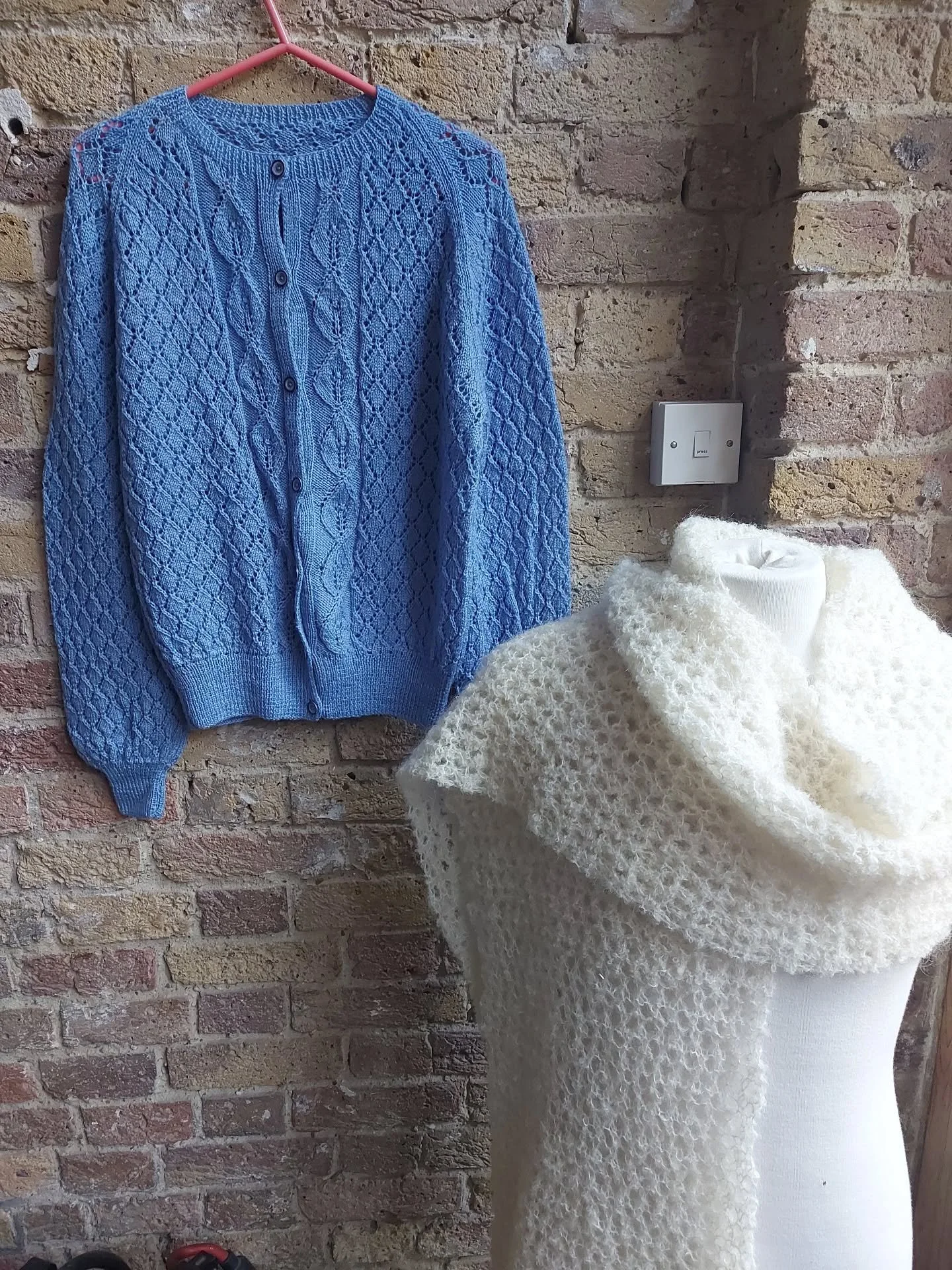 Shirley in the Isle of Man has sent us a lovely collection of yarny things and we especially like the lacy details in this cardigan, and, before draping this cosy scarf over the mannequin couldn't resist a quick try on to test its snugglyness!  It pa