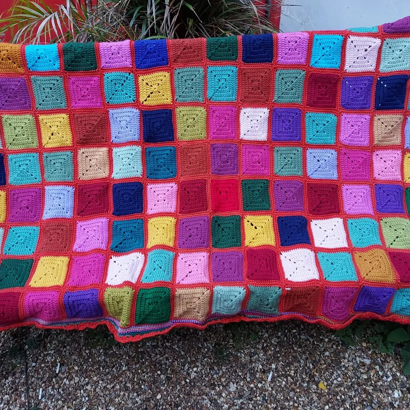 Gill in Moreton-in-Marsh has sent us this joyful blanket. We love the colours, and the design decisions, making a feature of the joining up, as well as a border to give it a perfect finish. Bright and cosy for someone's bed. 

Thank you, Jill. This i