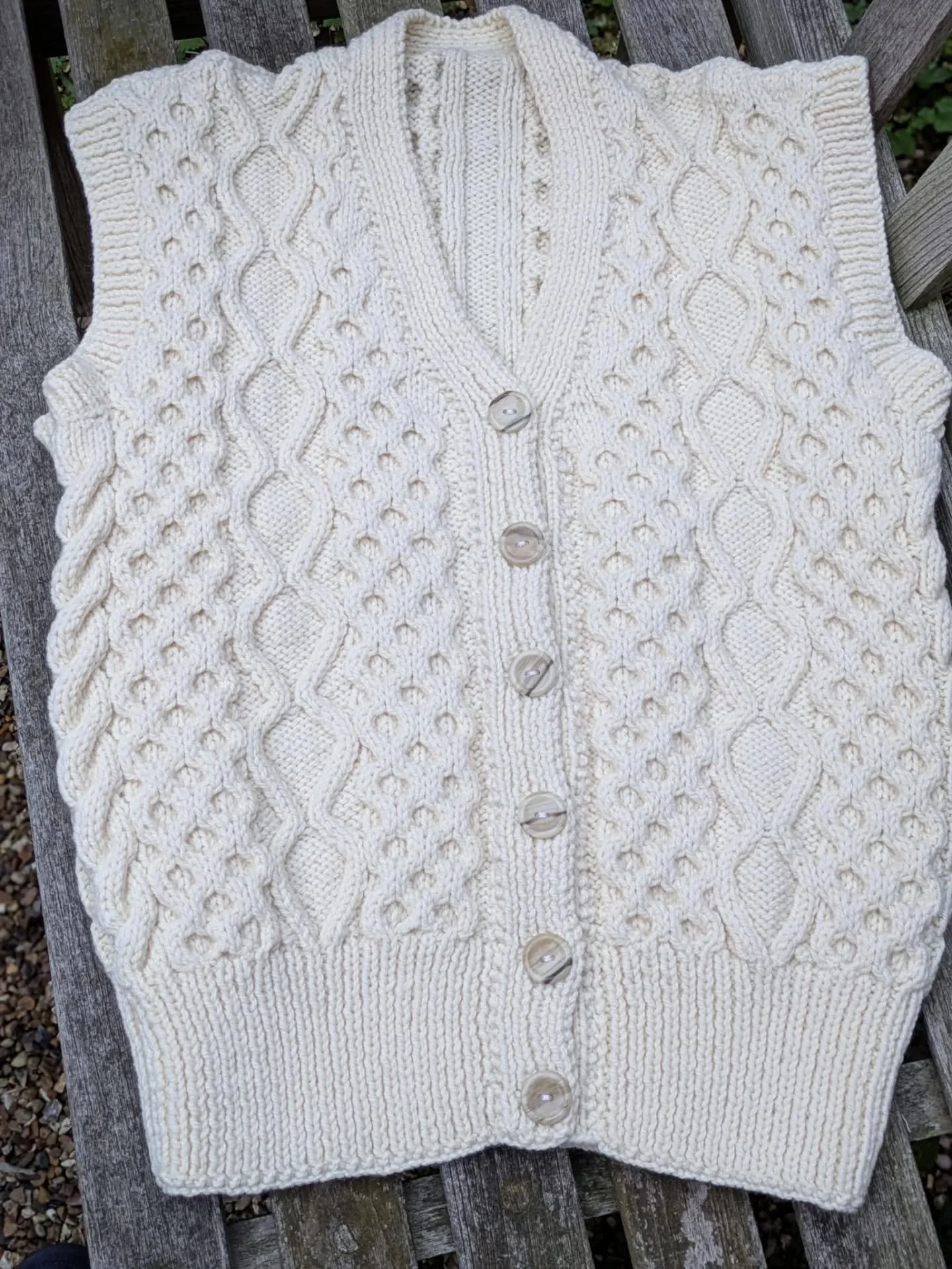 We can't stop celebrating the lovely things that our dedicated supporters have sent us.  Sandra donated a brilliant batch of yarny things, and we especially admire this striking cable design waistcoat.

Thank you, Sandra. This is our Knit of the Day!