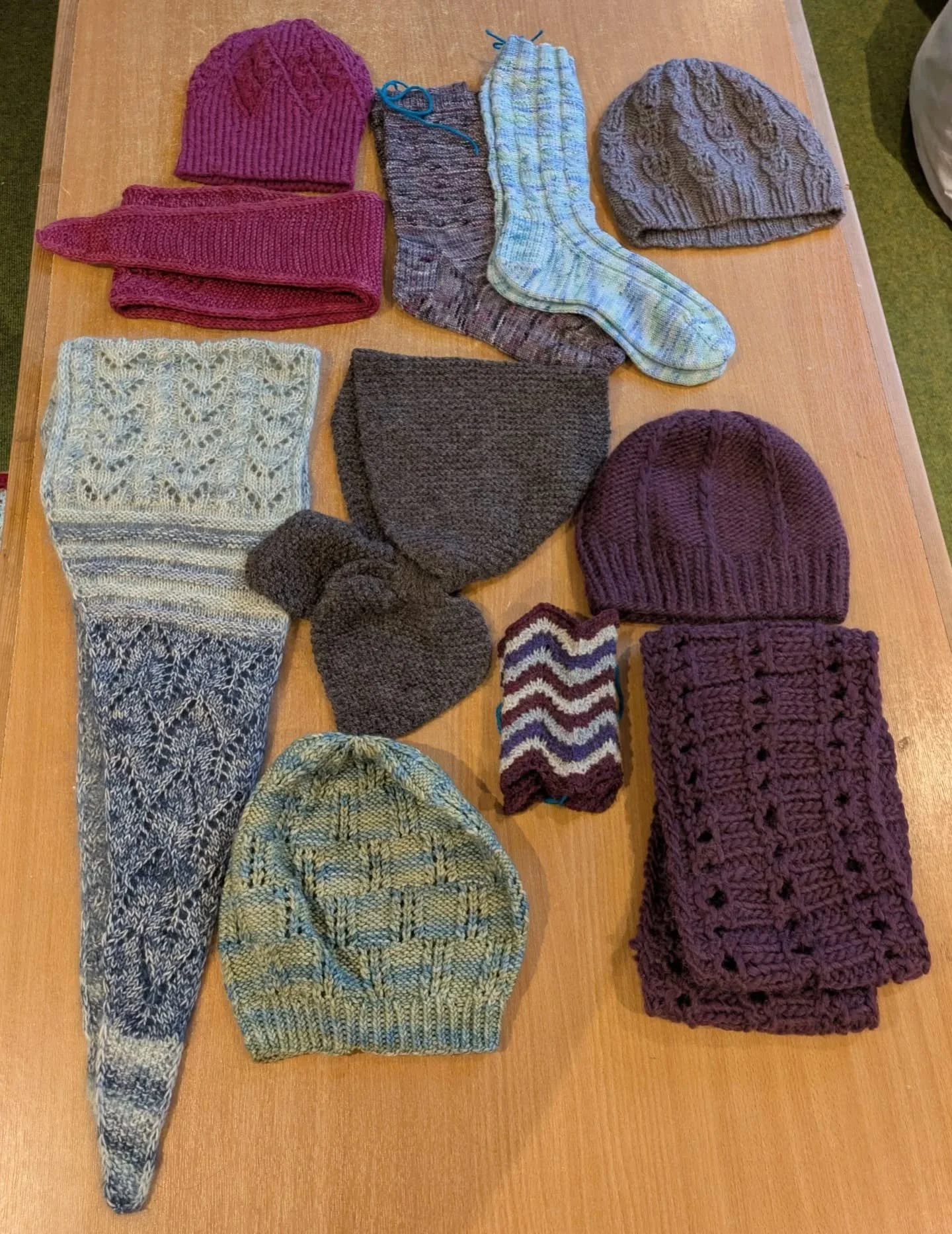 Long-time KFP supporter Pat, in Northumberland, has sent us this lovely collection of accessories using a range of techniques offering cosiness to necks, heads and toes. 
Such skill!  And such a lot of counting!

Thank you, Pat. These are our Knit of