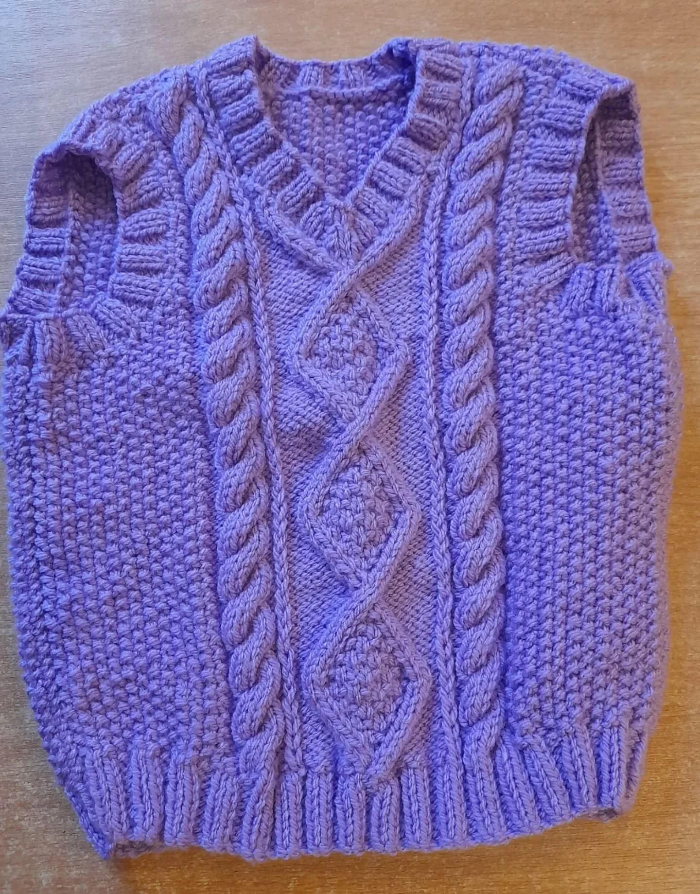 We do love a bit of Aran style knitting here at KFP HQ, and this sleeveless jumper is a splendid example.  It was sent to us by Enfield Knitting Group. It will be a stylish addition to any wardrobe. 

Thank you, Enfielld Knitters.  This is our Knit o