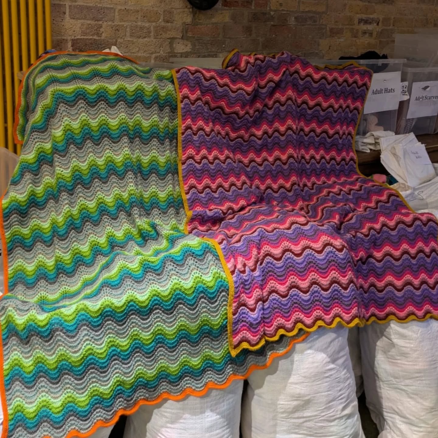 These bright and wavy blankets have been sent to us anonymously. We love the colours and admire the skill with which they've been made. They will certainly bring some jolly cosiness to someone. 

Thank you, Knitters. These are our Knit of the Day! 

