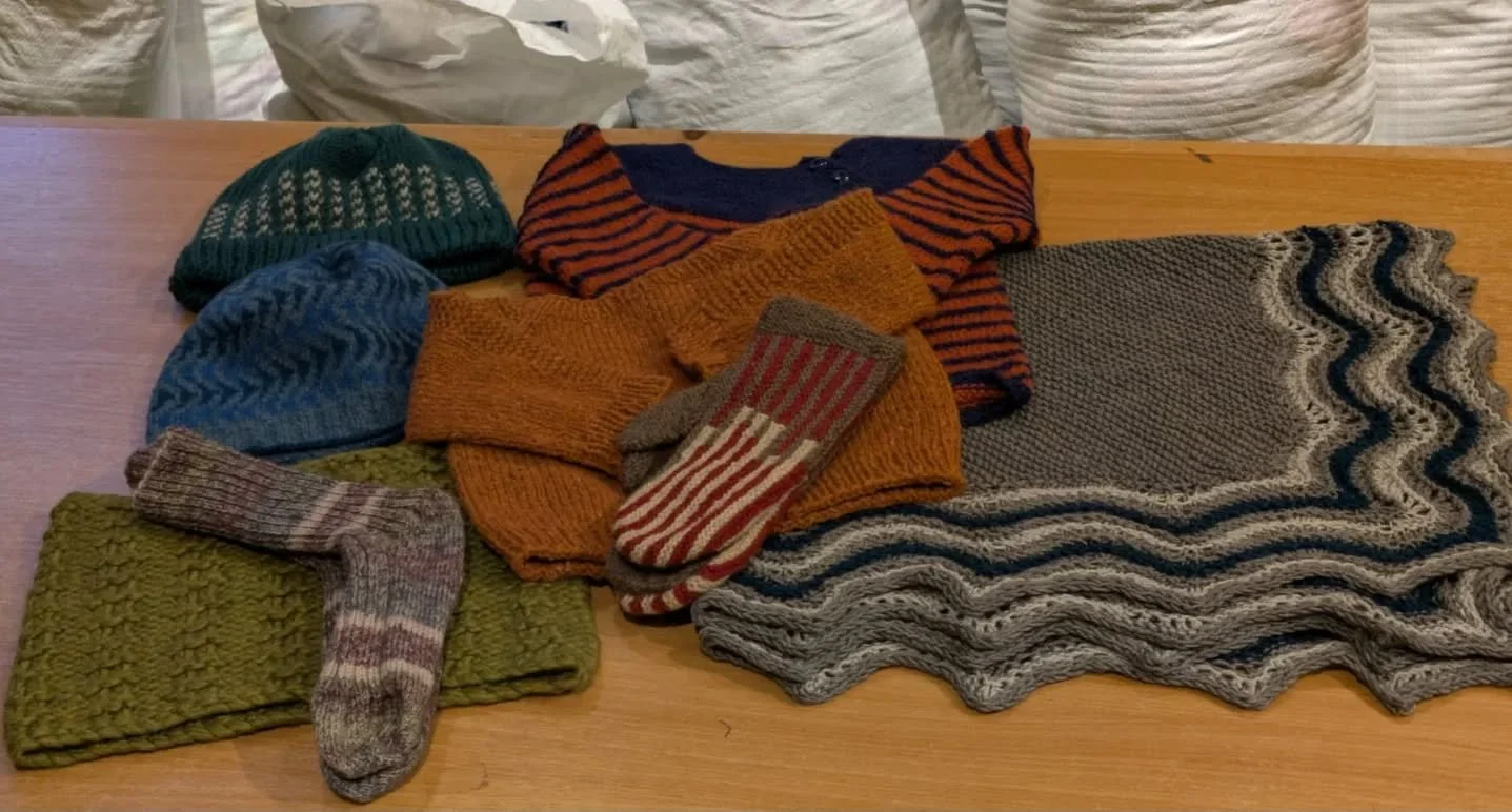 Dawn has sent us a fantastic collection of knitted goodies.  Warm colours, textures, stranded colourwork, remarkable skill, and great generosity - all the things we admire.  And socks and gloves, which are in great demand. 

Thank you, Dawn. These ar