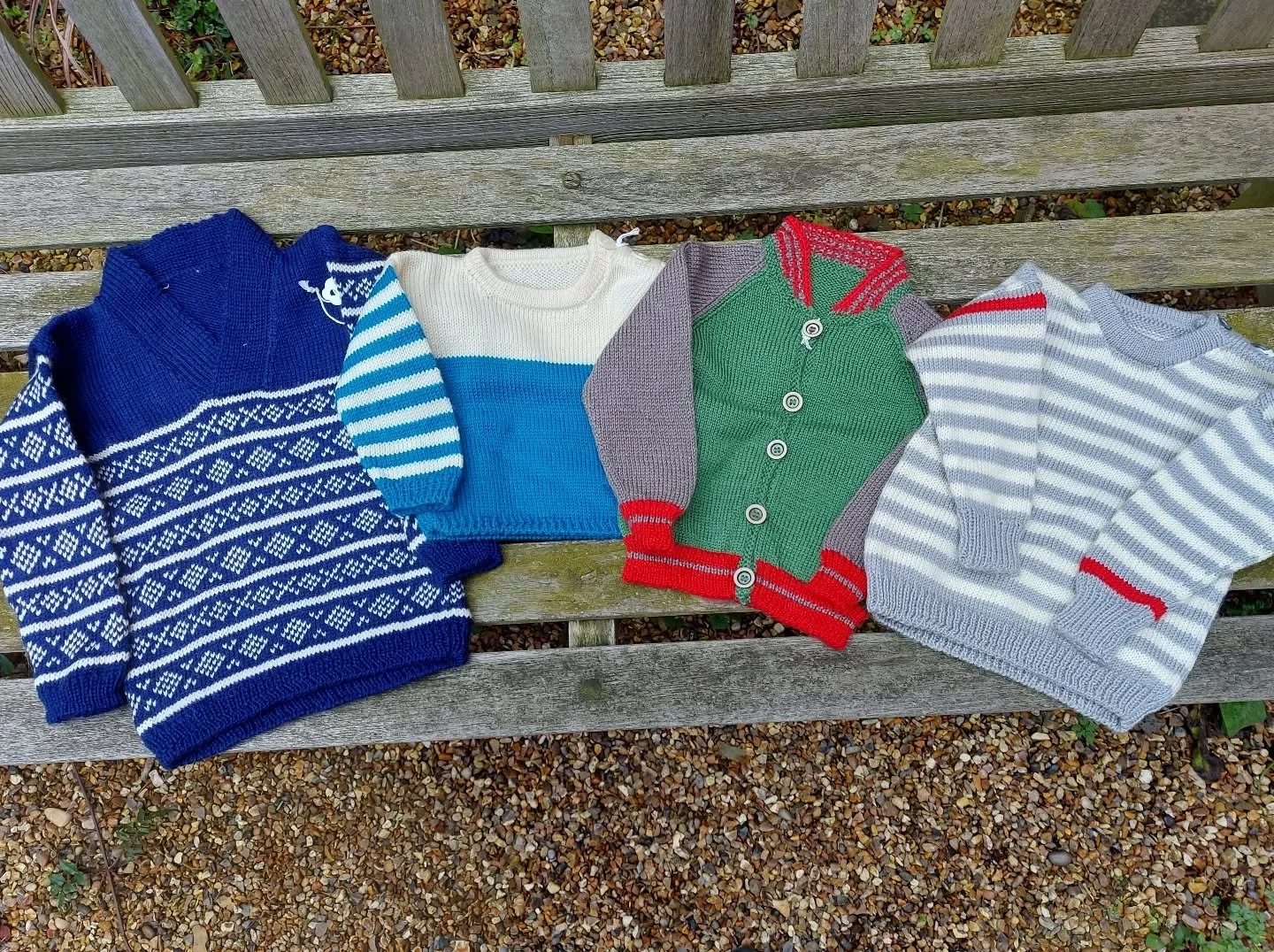 Maggie in Aberdeen sent us a big batch of yarny treats, and we love these little cardigans and jumpers.  You know how much we enjoy colour detail and these are so very stylish.

Thank you, Maggie. These are our Knit of the Day!

#knitoftheday #handkn