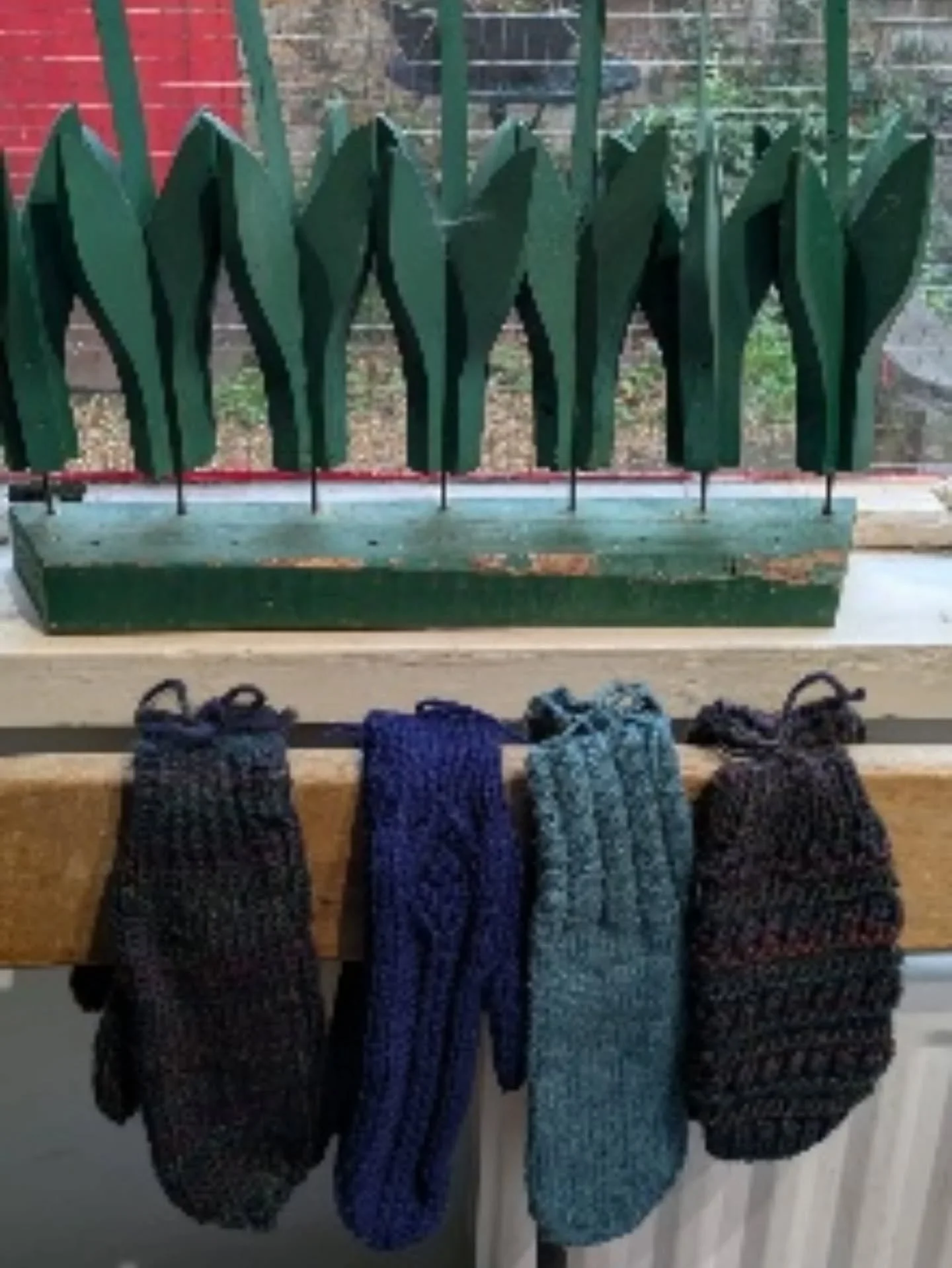 C in Northamptonshire has sent us a lovely collection of mittens.  It was another rainy day, and Stella used the bench by the door for the display!  Adult and child sized mittens and gloves are always in demand, and we're very grateful for every pair