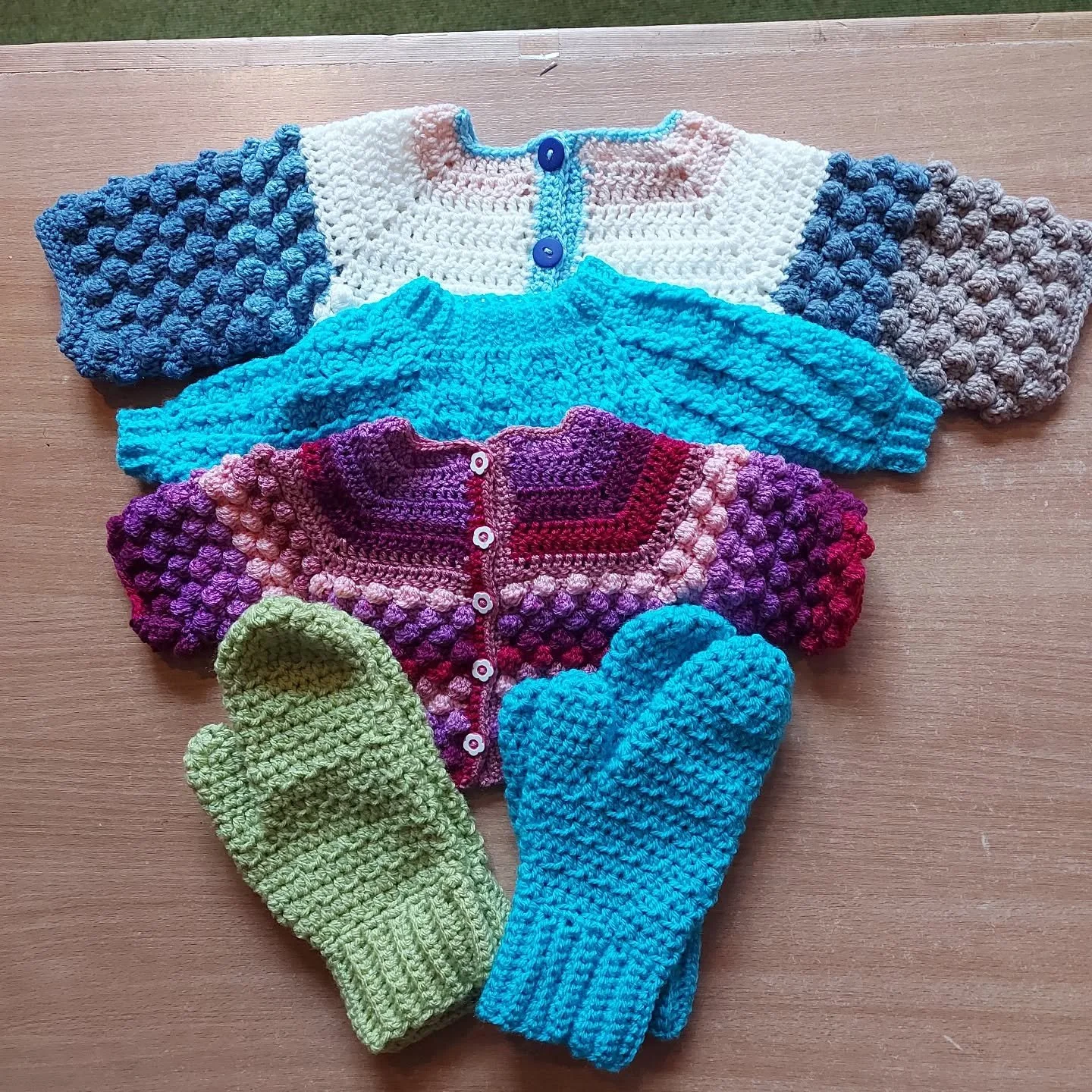 Christine in Saltburn-by-the-Sea has sent us the lovely collection of baby crocheted items.  We love the textures and colours in the cardigans, and gloves in all sized are always in demand. 

Thank you, Christine. These are our Crochet of the Day!

#