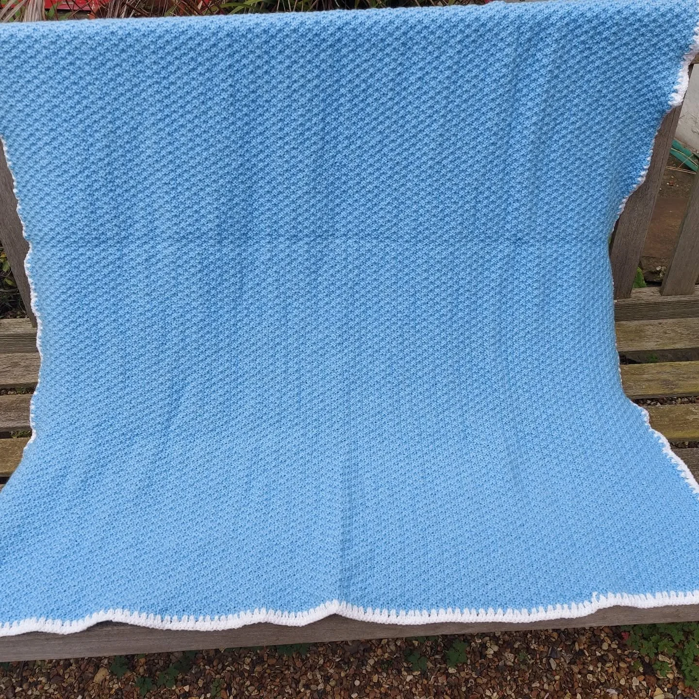 Theresa in Eastbourne has sent us this beautifully made blanket. Its simple design focuses on the moss stitch texture and the contrasting crocheted border.

Thank you, Theresa. This is our Knit and Crochet of the Day! 

#knitandcrochetoftheday #blueb