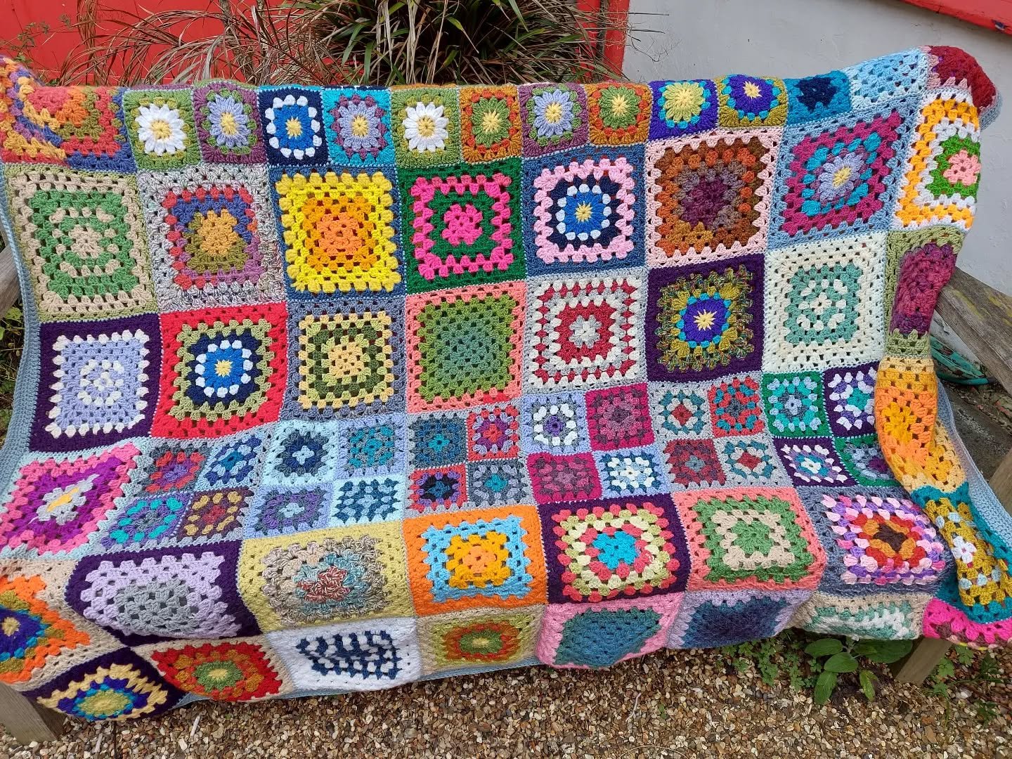 Jean has sent us this amazing blanket on behalf of the Cheddar Textile group.  She says that it is made from squares left over from their Christmas tree.  That tree must have been quite something to see!  Just look at all the colours and different si