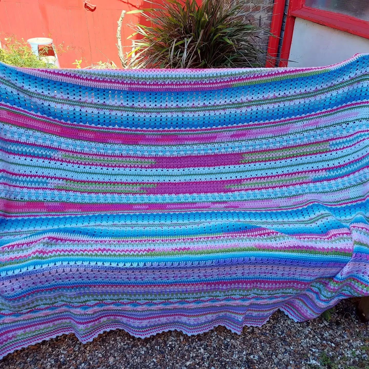 A Nony Mous has been very busy crocheting this beautiful blanket. If you look closely, you'll see the wide variety of stitch patterns used as well as all the different colours.  There's so much work in it, and how cosy it must have been to snuggle un