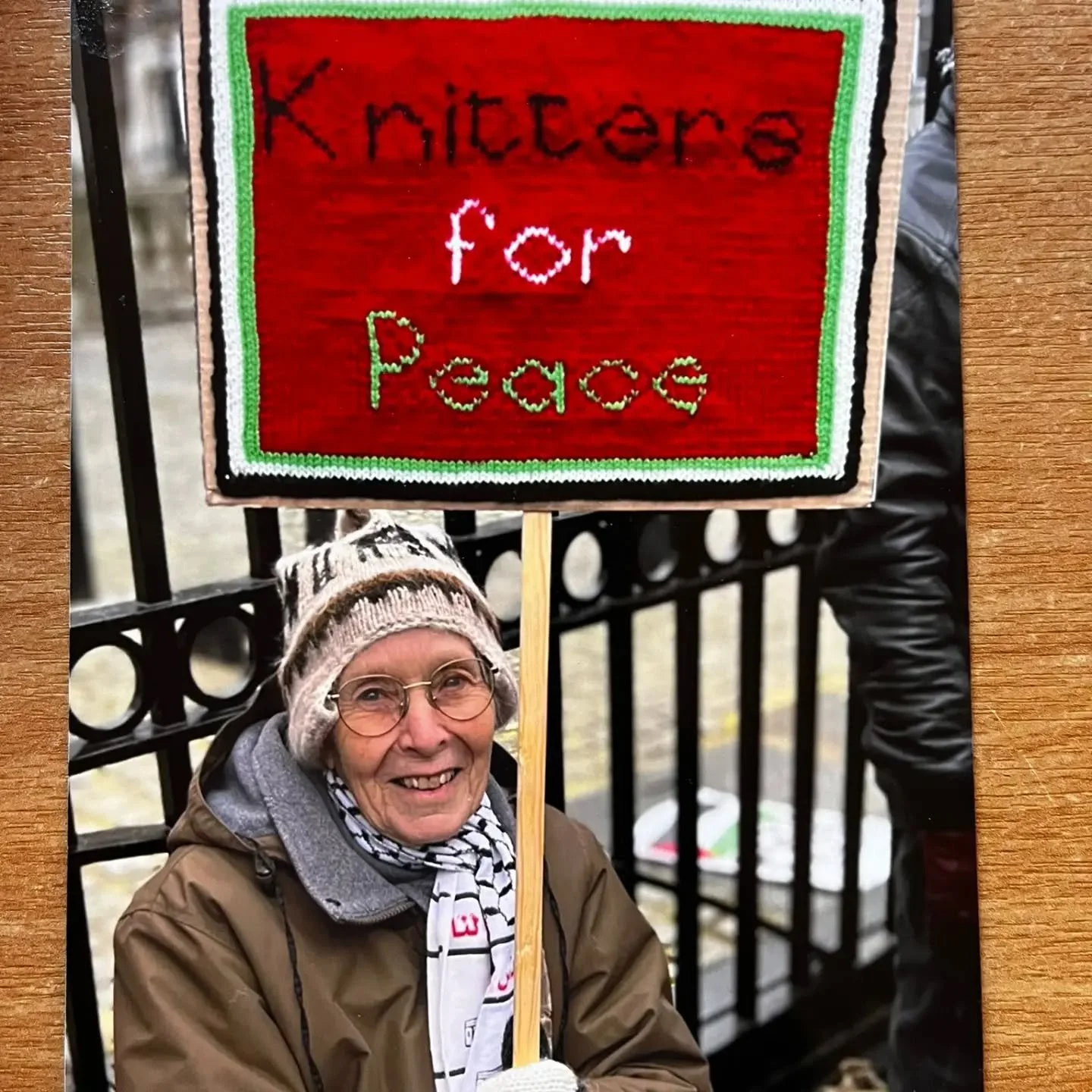 We were delighted to meet Gill when she visited the office earlier today. She shared this great photo with us. She told us that she takes her Knitters for Peace sign with her to demonstrations across London supporting causes close to her heart.

Than