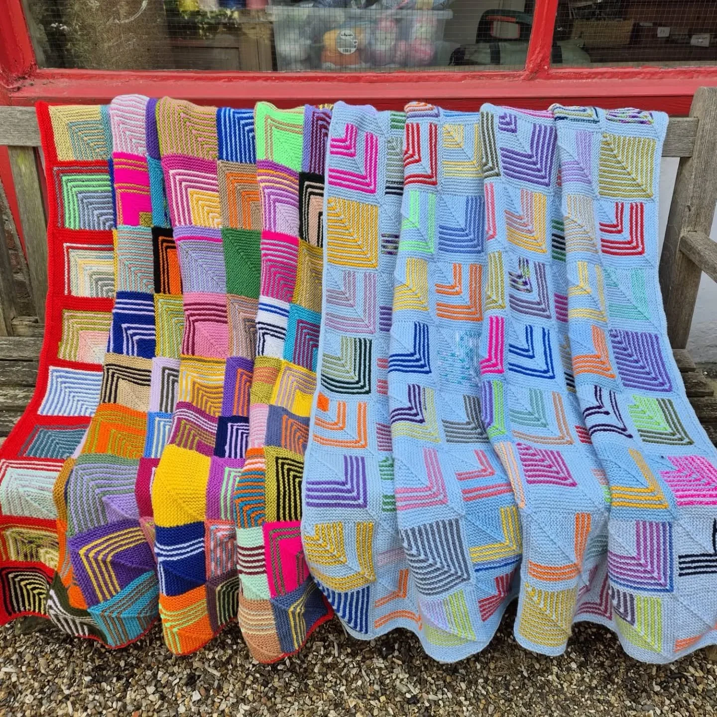 Annette in Folkestone has sent us these magnificent blankets. We do love a mitred square, and these show how you can make a vibrant pattern by using stripes ...and  by choosing one dominant colour, in combination with a variety of others it's also a 