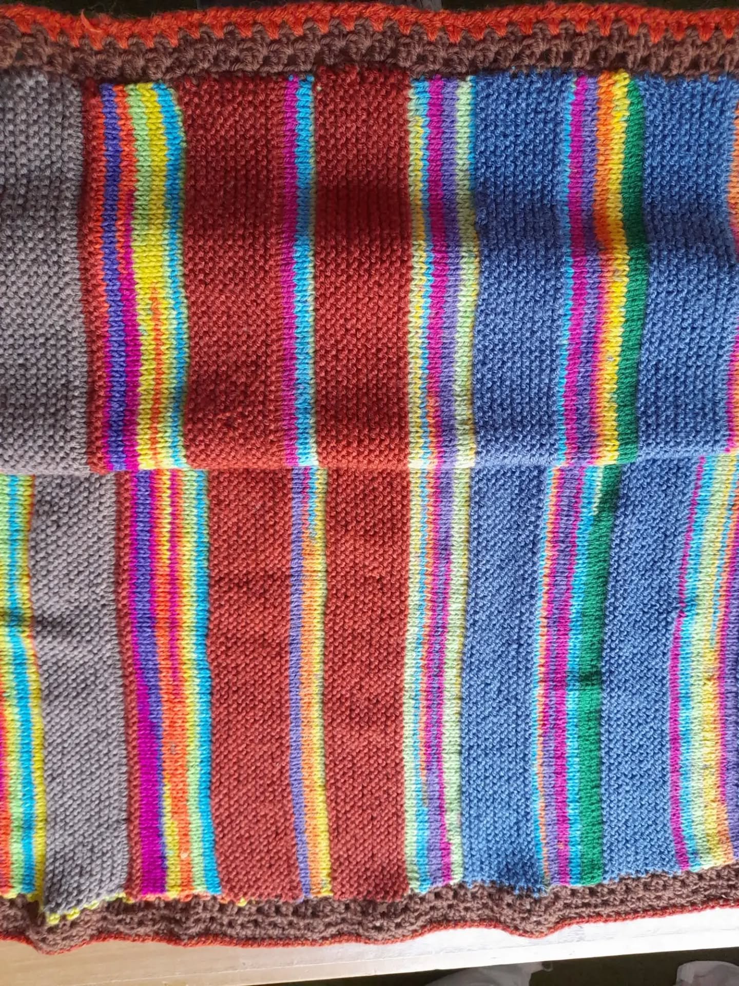 We do love a bright stripe here at KFP HQ, and this blanket, sent to us anonymously, made us all smile. It has the added bonus of a crocheted edging, making it a lovely gift for someone. 

Thank you, Knitters and Crocheters. This our Knit and Crochet