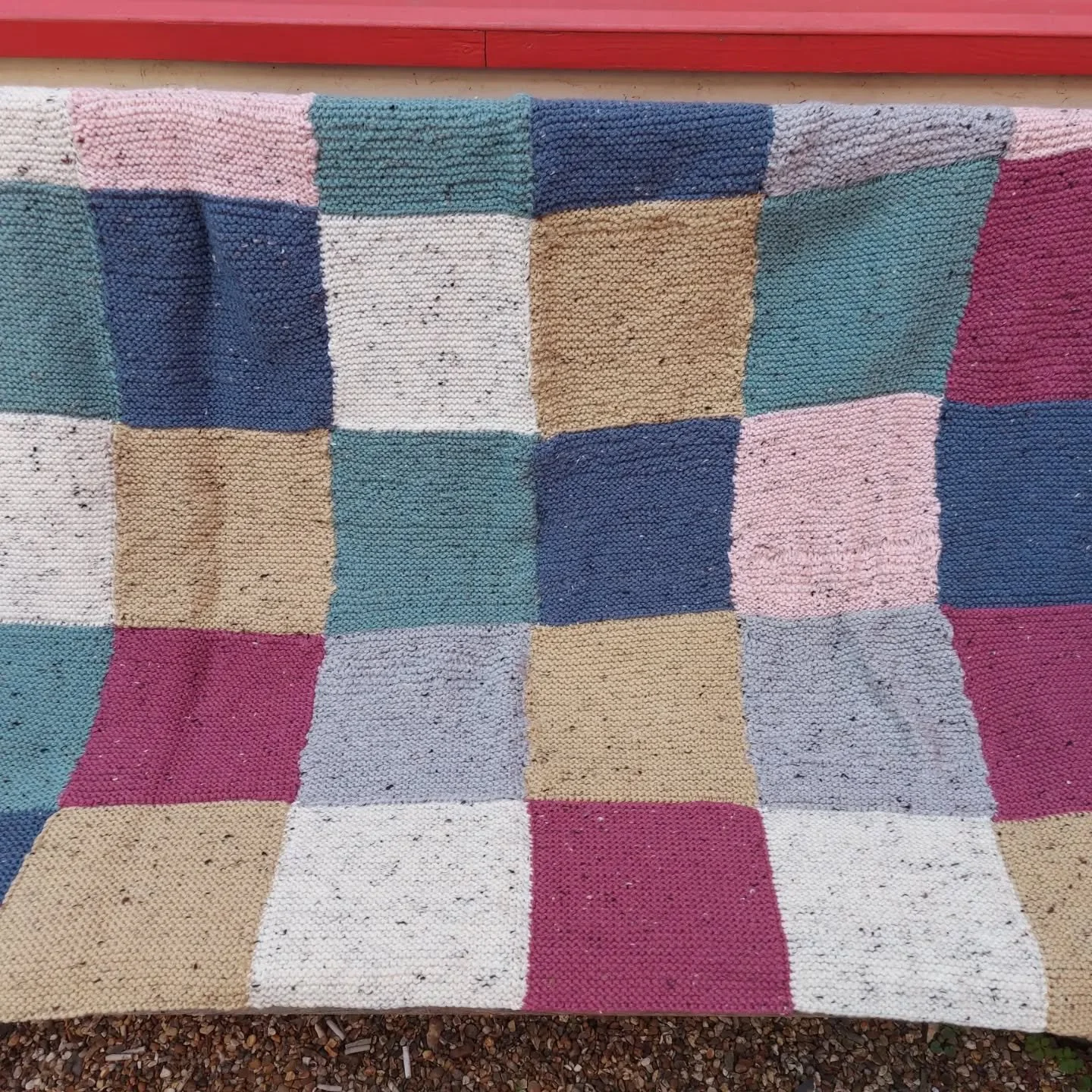This great blanket arrived with an excellent provenance. It was sent to us by Worth School in West Sussex. It was made by a group of students, only one of whom already knew how to knit. Three of the contributors did it as part of their volunteering a