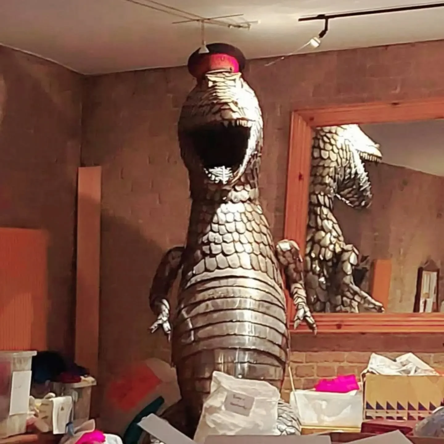 We've exciting news!  Many of our visitors, and all of our staff and volunteers, love the dinosaur, which dominates our Knitting Room at KFP HQ, but until a recent chance discovery during our office clear out, we didn't know anything about his histor