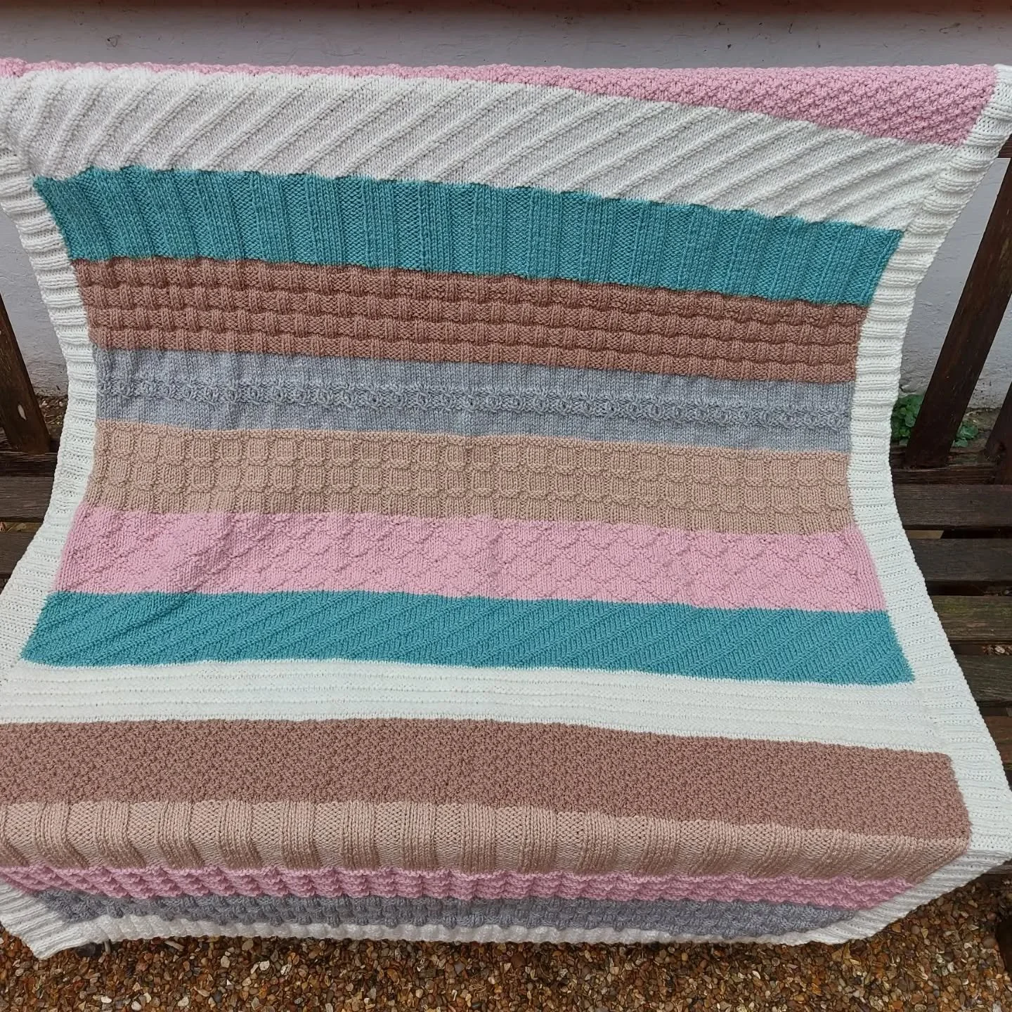 We love the variety of stitches and textures in this brilliant blanket from regular, generous donor Cheryl in Peterborough. It's lovely to see another way to create interest and tactile pleasure in blanket knitting - and with a finished edging!

Than