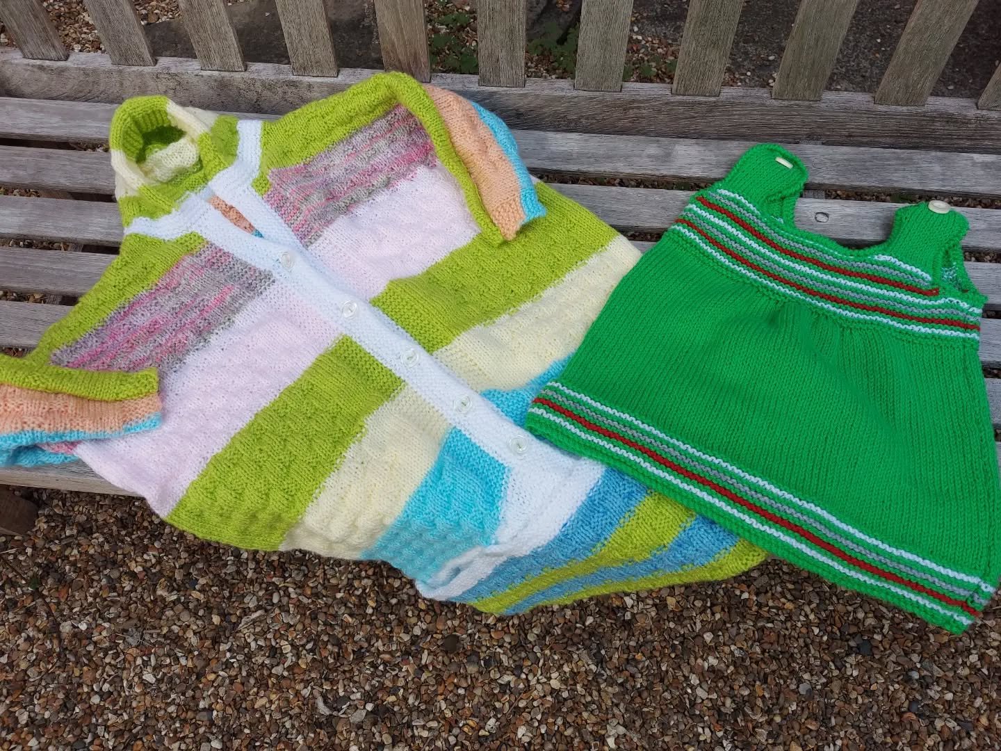 Enfield Library Knitting Group brought us a wonderful selection of yarny goodies. We don't receive many little dresses, and this one is especially cute, while the sleep suit is in cheerful bold colours. 

Thank you, Enfield. These are our Knit of the