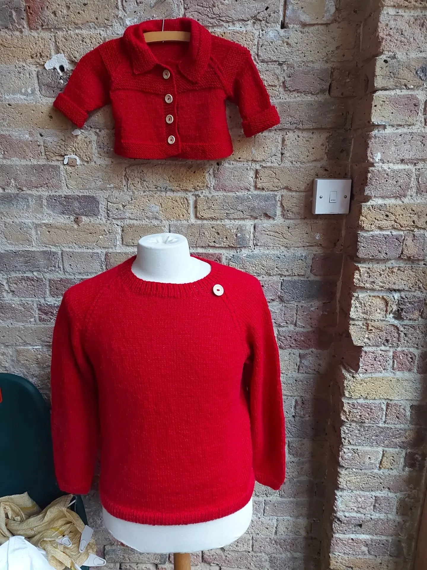 We do love a red jumper here at KFP HQ, and here is double the love! 'Cute' is the best word to describe the little jacket with its statement buttons. And is that button detail on the bigger jumper from the same range?  It certainly creates a focus a