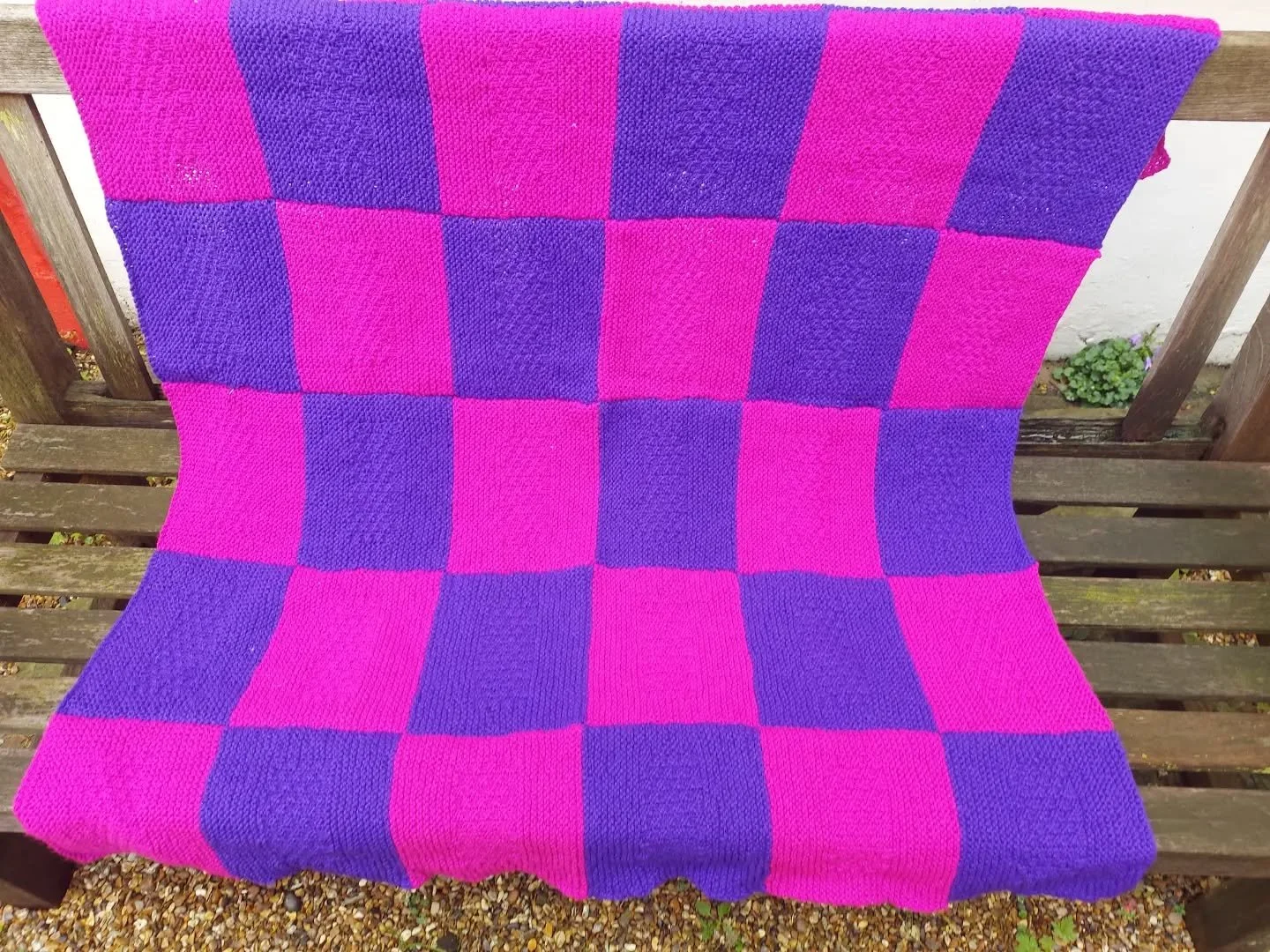Just look at these gorgeous bright colours expertly combined by Jane in Maidstone! There is texture in there, too, with a stitch pattern in each square. This blanket will bring colour and cosiness wherever it goes. 

Thank you, Jane. This is our Knit