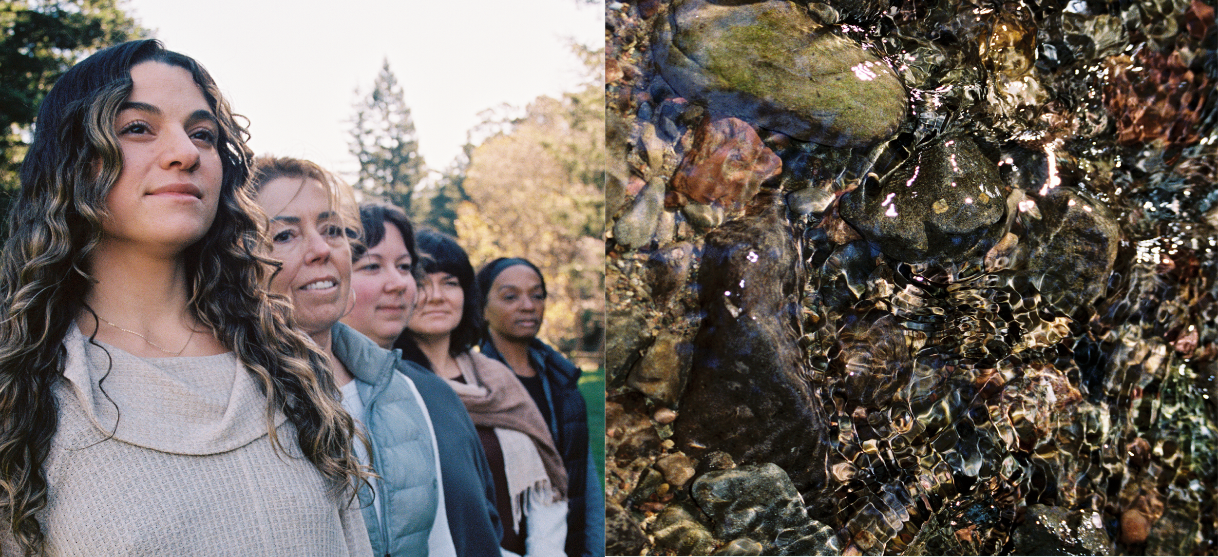A group of women standing outdoors in a park or forest, with trees and clear sky in the background, on the left side; on the right side, close-up of a rocky stream with small, wet rocks and water flowing over them.