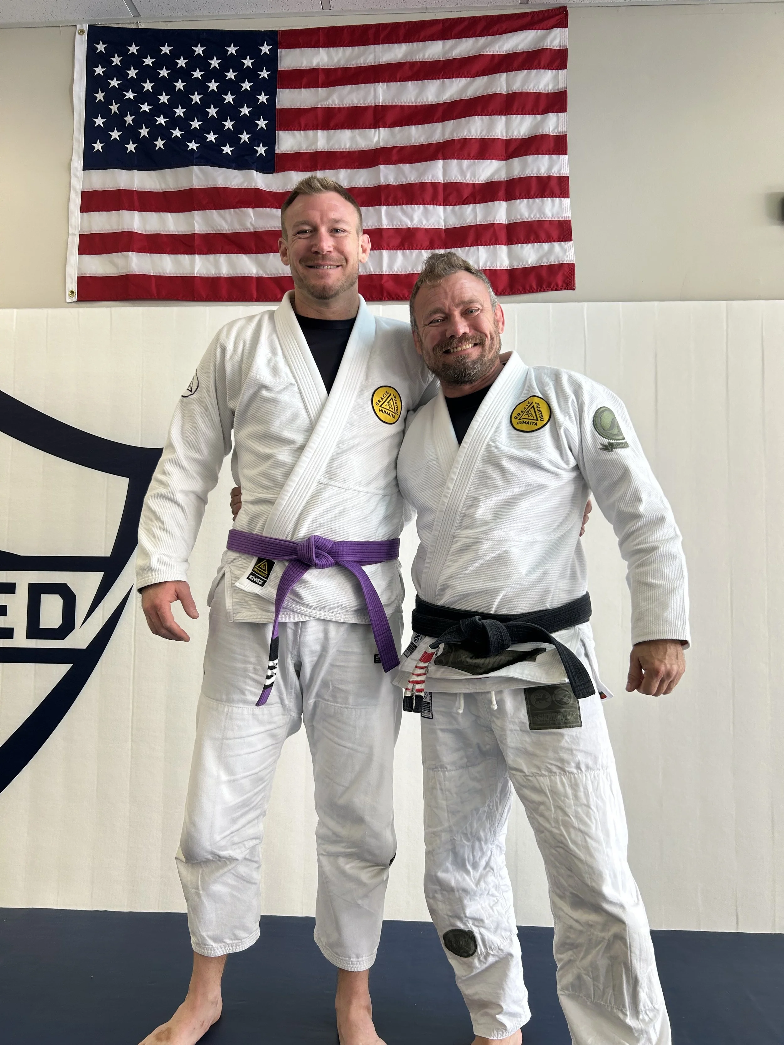 Forged Jiu Jitsu head instructor Justin Edel with mentor JW Write of Gracie Humaita at the academy in Ozark, Missouri, providing Brazilian Jiu Jitsu and self-defense training for Ozark, Nixa, and Springfield MO.
