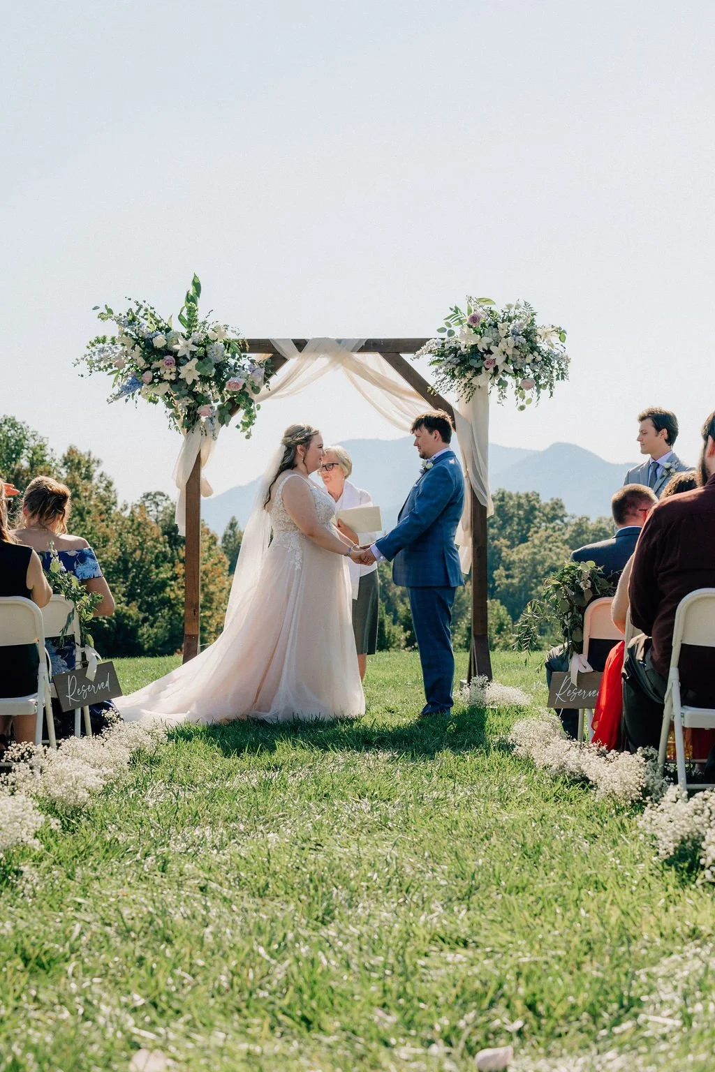 Bride and groom getting married, wedding designed by a Charlotte wedding planner