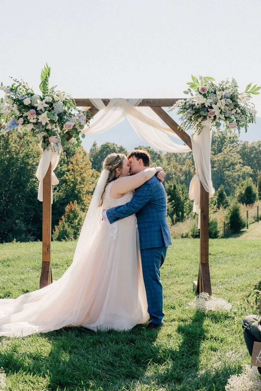 Bride and groom kissing at their wedding planned by a Charlotte wedding planner