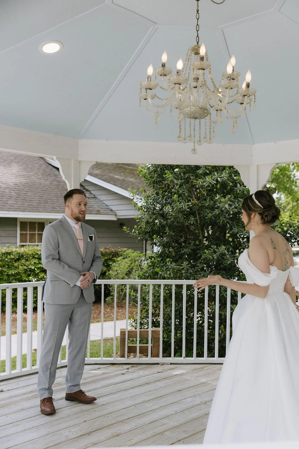 Bride and groom share a first look under the gazebo at The Village House at Litchfield — planned by Charlotte Wedding Planner.