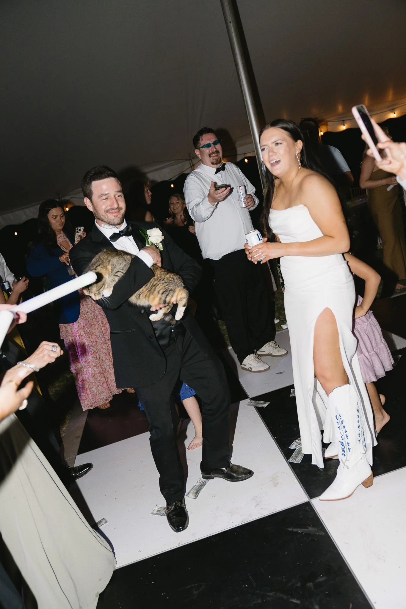 People dancing at tented wedding planned by Charlotte wedding planner