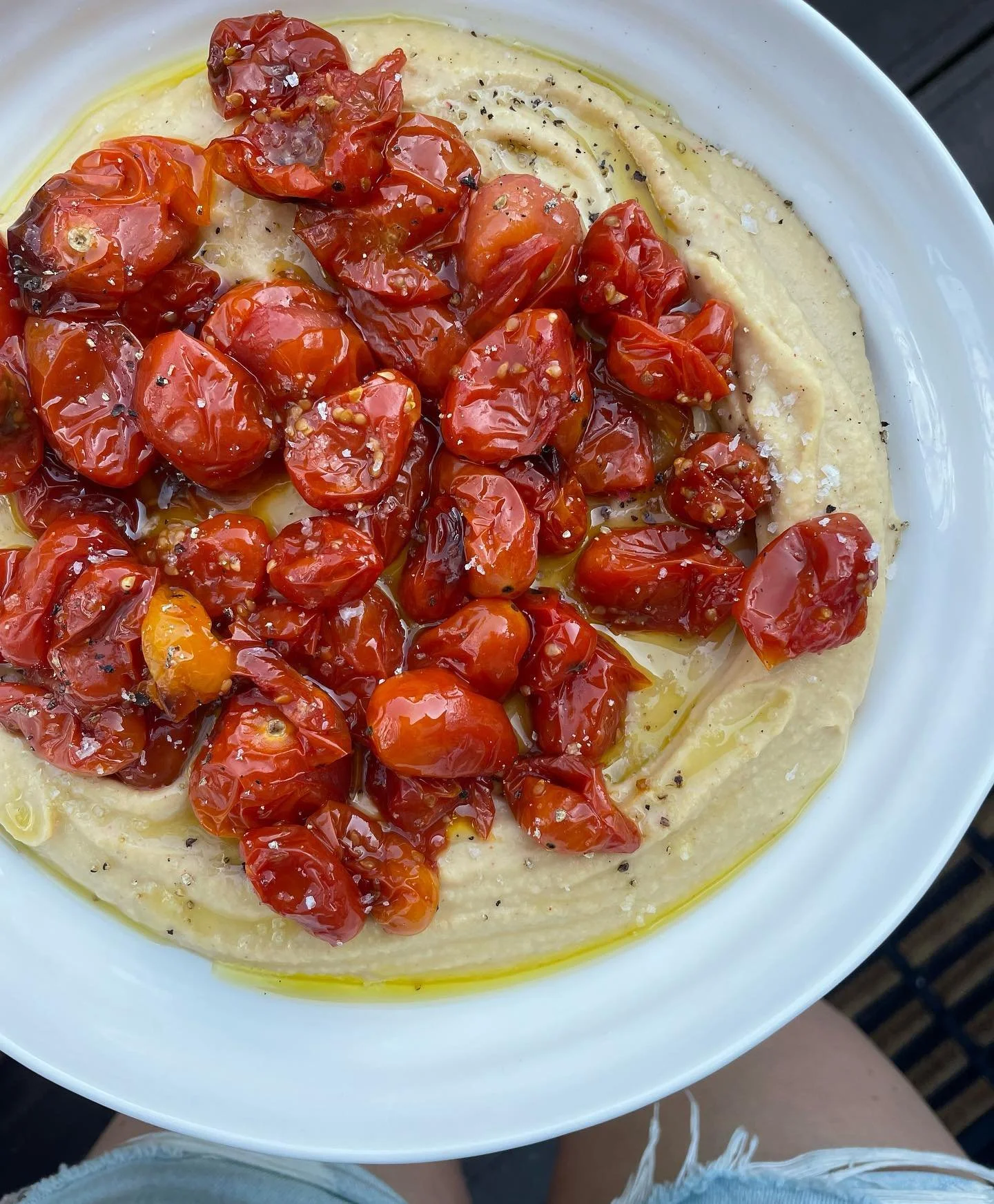 On repeat this summer 🔁

Silky smooth hummus topped with jammy confit tomatoes🍅 

The perfect dip/spread/side/snack/accompaniment/meal. 

I make hummus by whizzing together chickpeas, tahini, lemon juice, a little garlic, cumin, paprika, salt, litt
