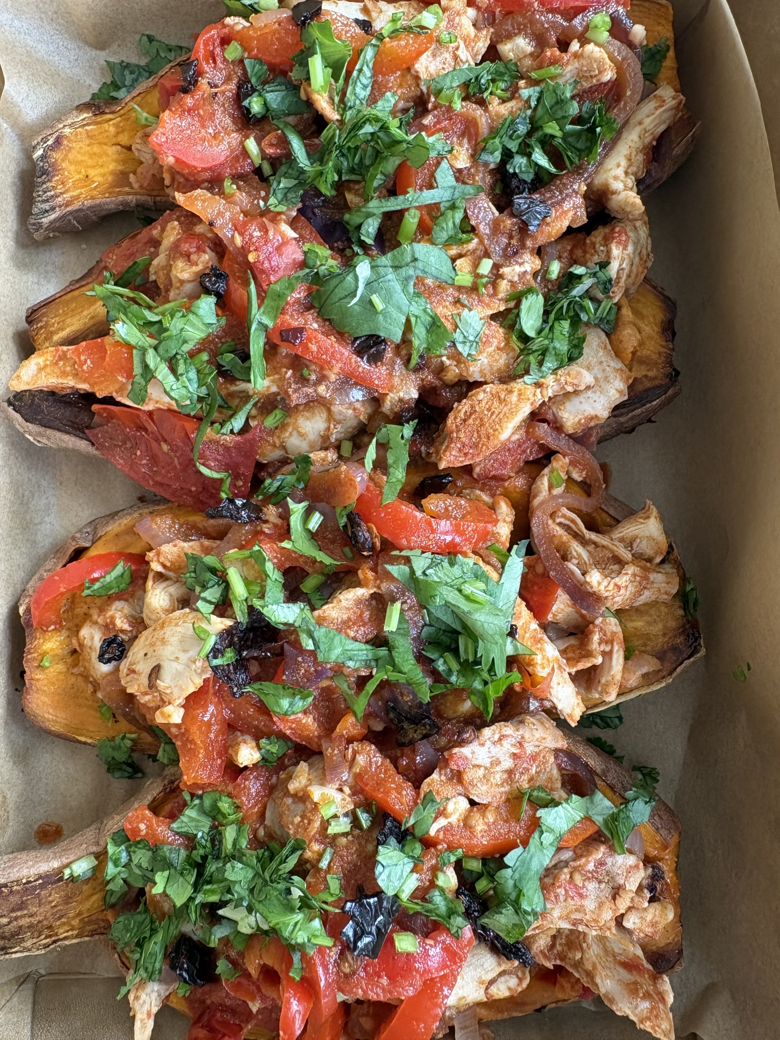 Mexican spiced shredded chicken, served in a baked sweet potato