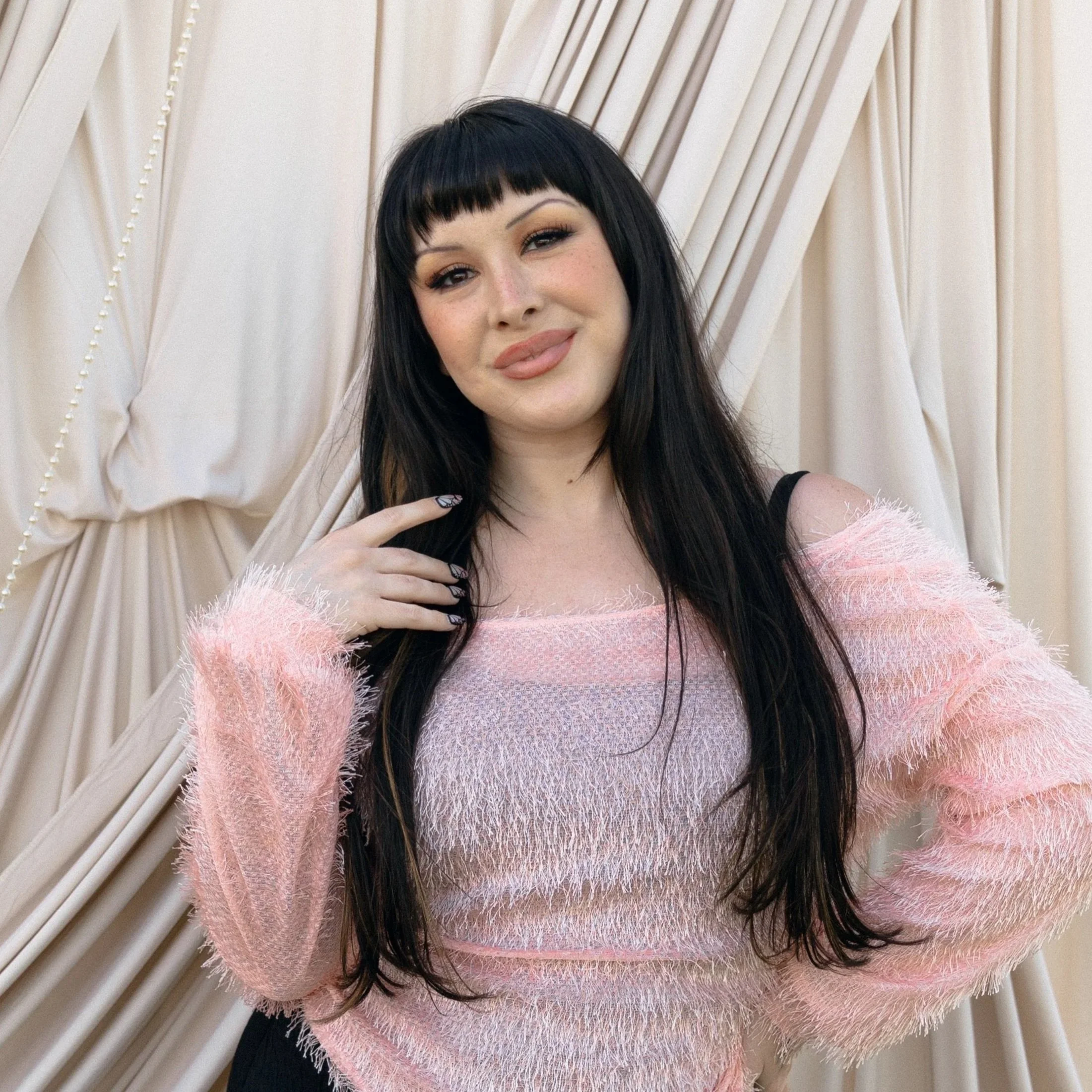 Person writing in a spiral-bound planner with black pen, surrounded by office supplies, planning your next special occasion.